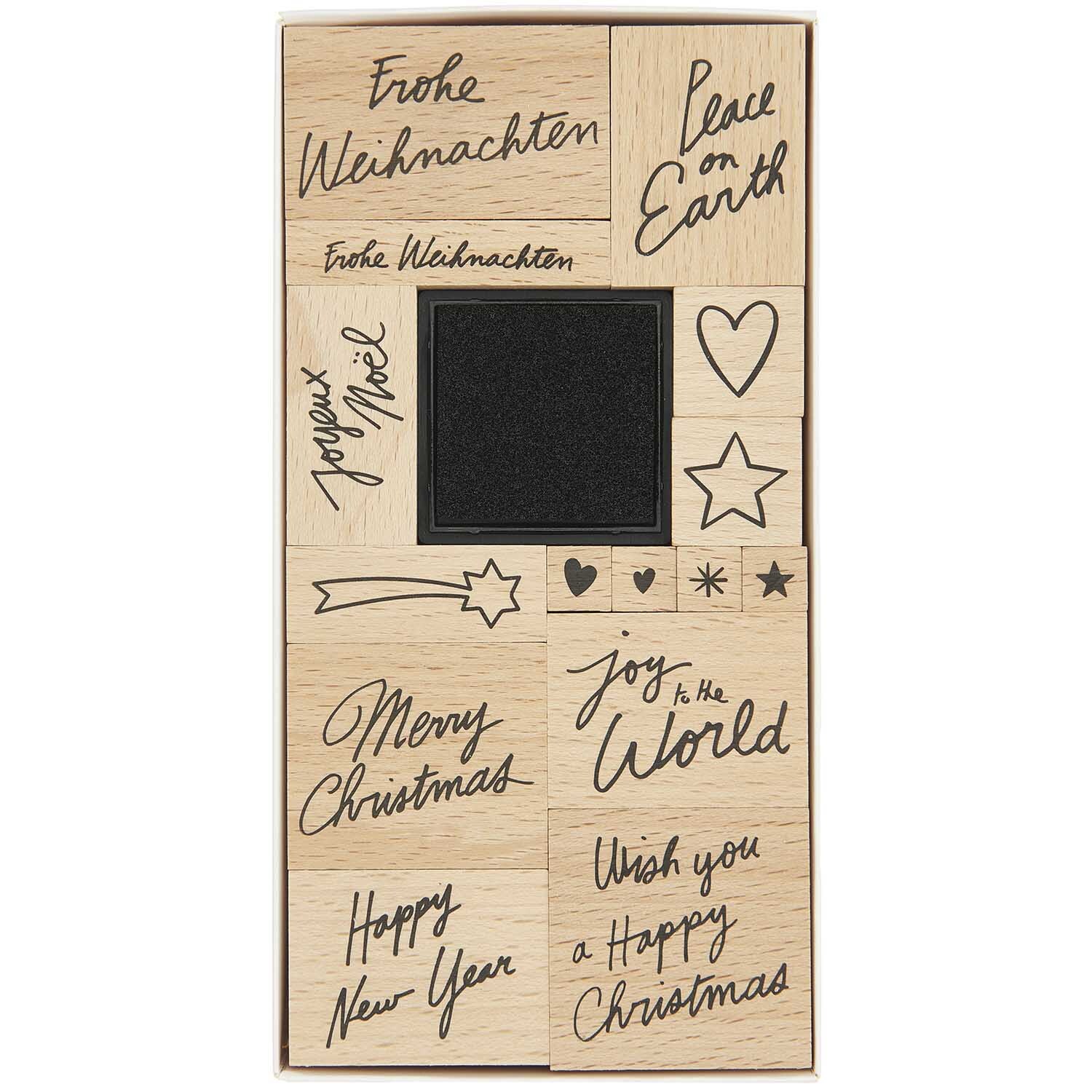 Paper Poetry Stempelset Handlettering: 16-teiliges Set mit festlichen Motiven und Sprüchen, ideal für kreative Weihnachtsprojekte.