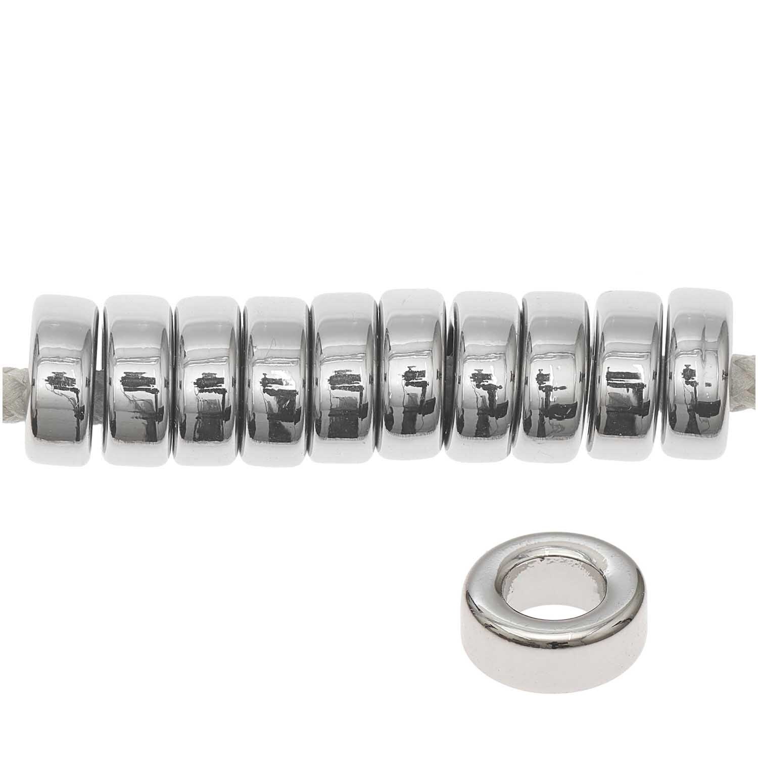 itoshii - Ponii Beads Ringe 9x3,5mm 10 Stück Farbe Silber von Rico Design Itoshii - Ponii Beads Ringe, 9x3,5mm, 10 Stück, von Rico Design. Zehn silberne Ringe in einer Reihe.
