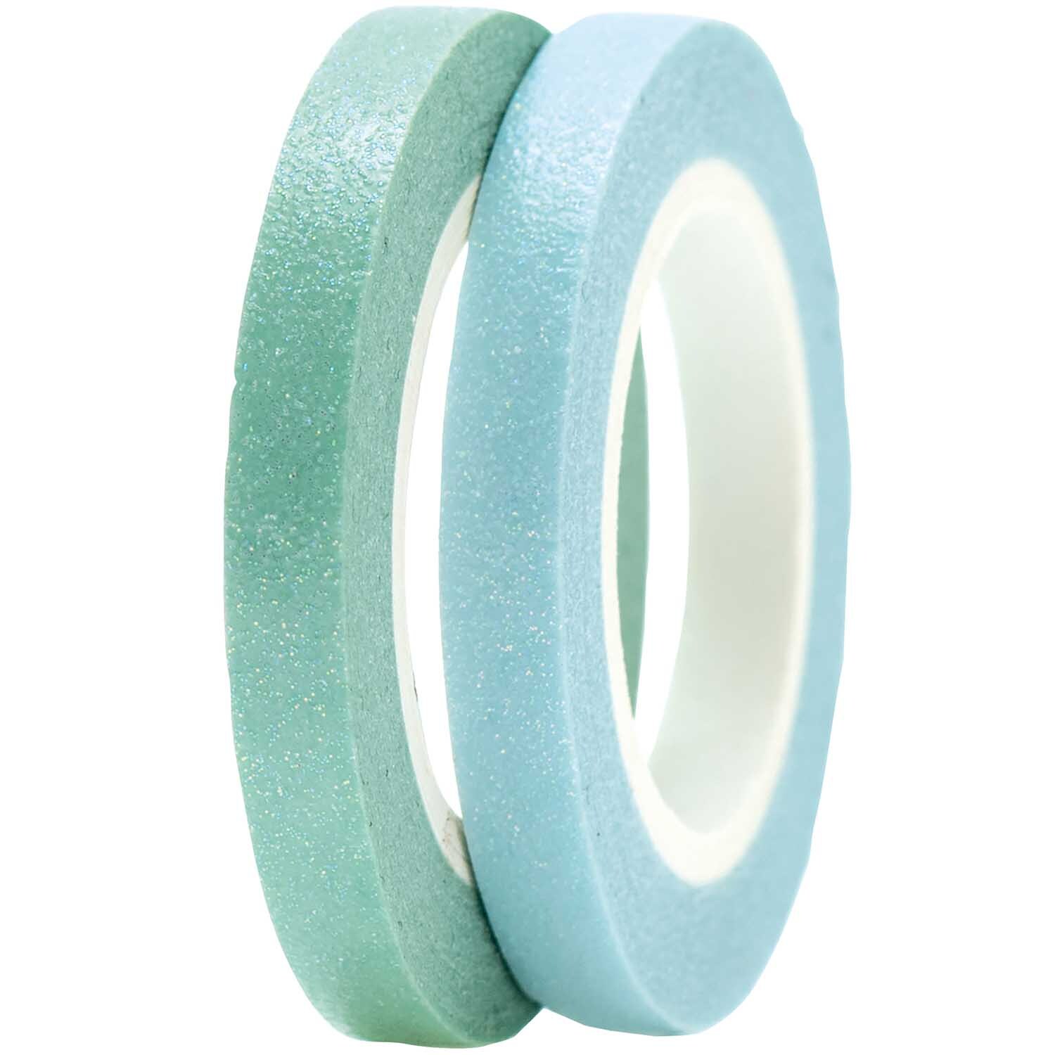 Paper Poetry Tapes Glitter mm 5m 2 Stück von Rico Design in Blau-Grün, zwei Rollen mit glitzernder Oberfläche.