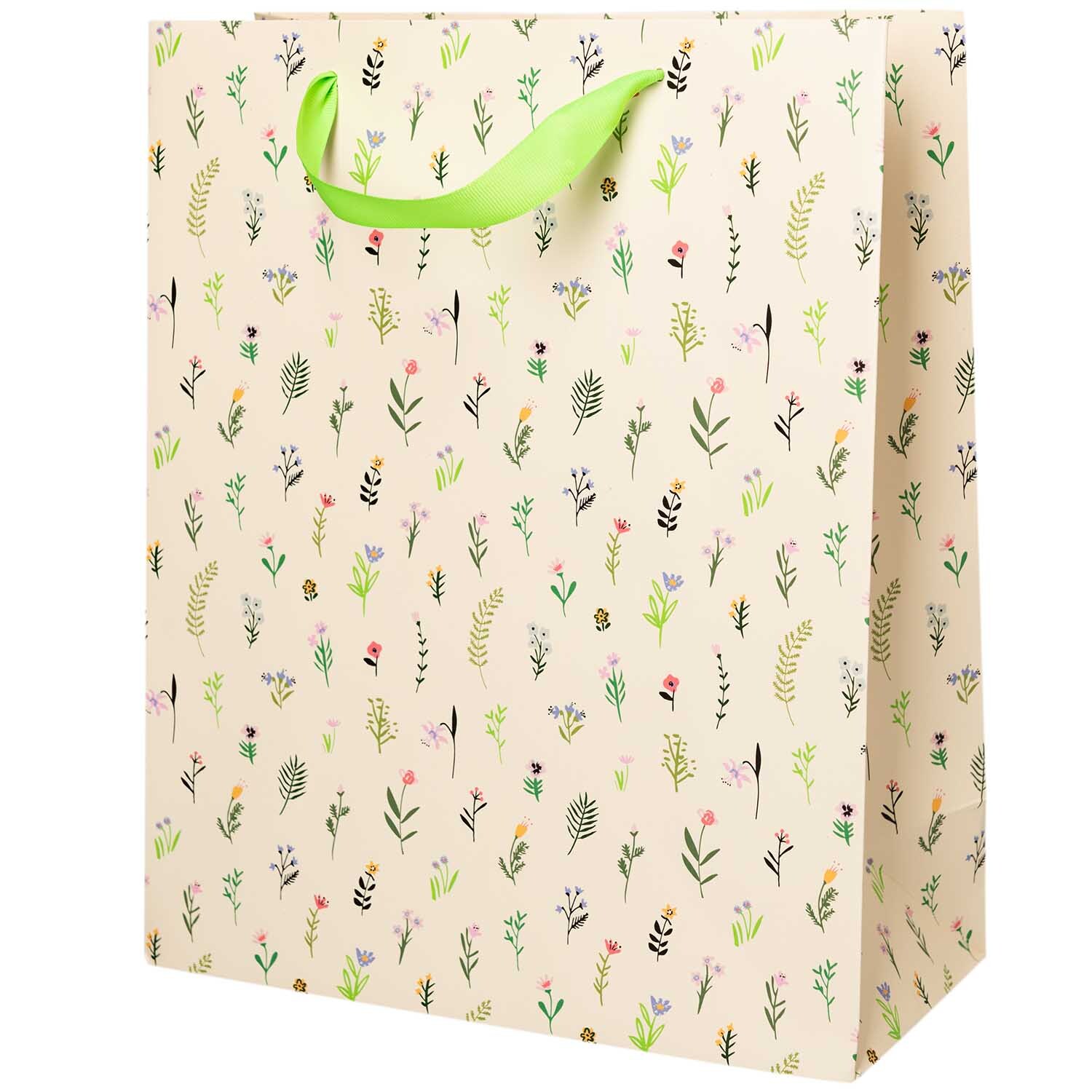 Paper Poetry Geschenktüte mit Streublumenmuster und grünem Griff, ideal für Geschenke.