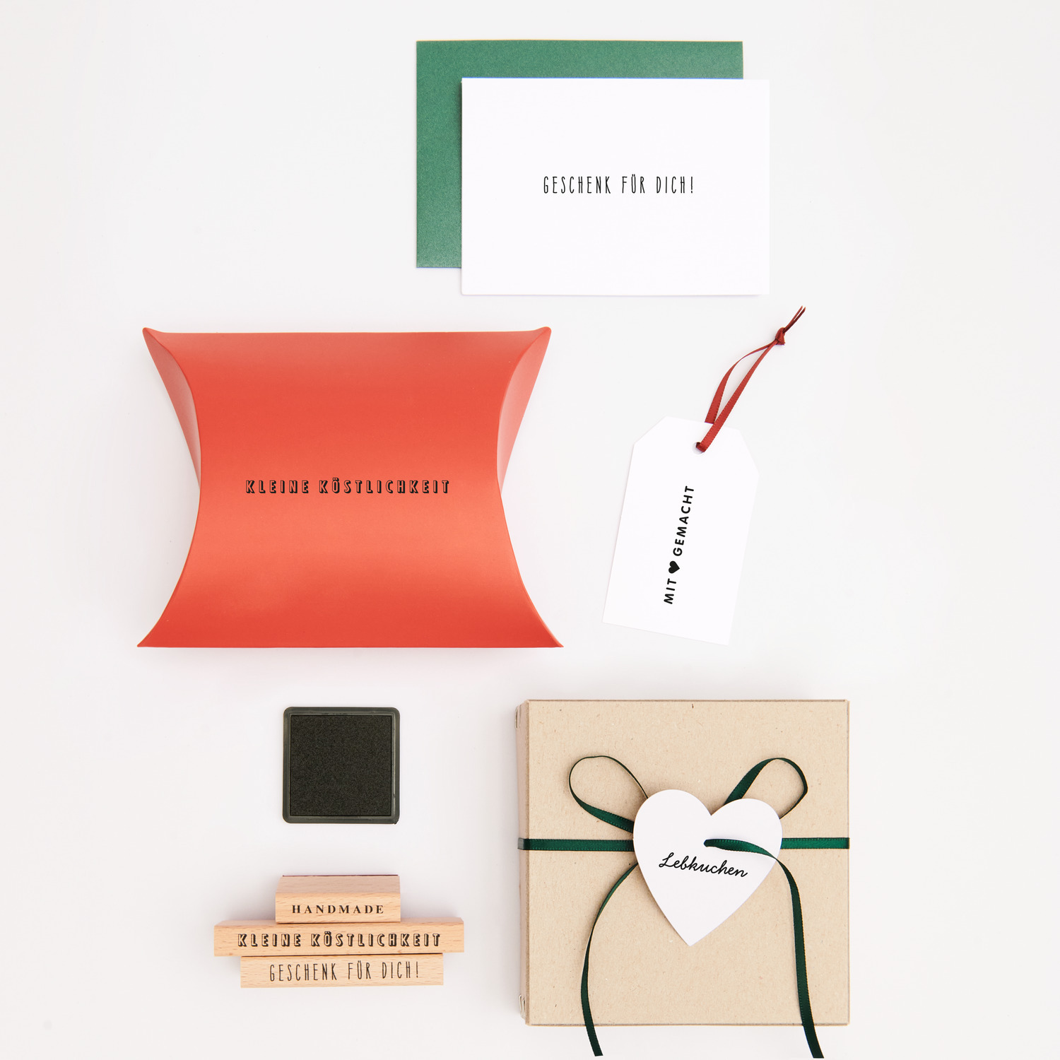 Paper Poetry Stempelset Weihnachtsbäckerei: 24-teiliges Set mit Stempeln, Geschenkboxen und Karten in festlichen Farben, ideal für kreative Weihnachtsprojekte.