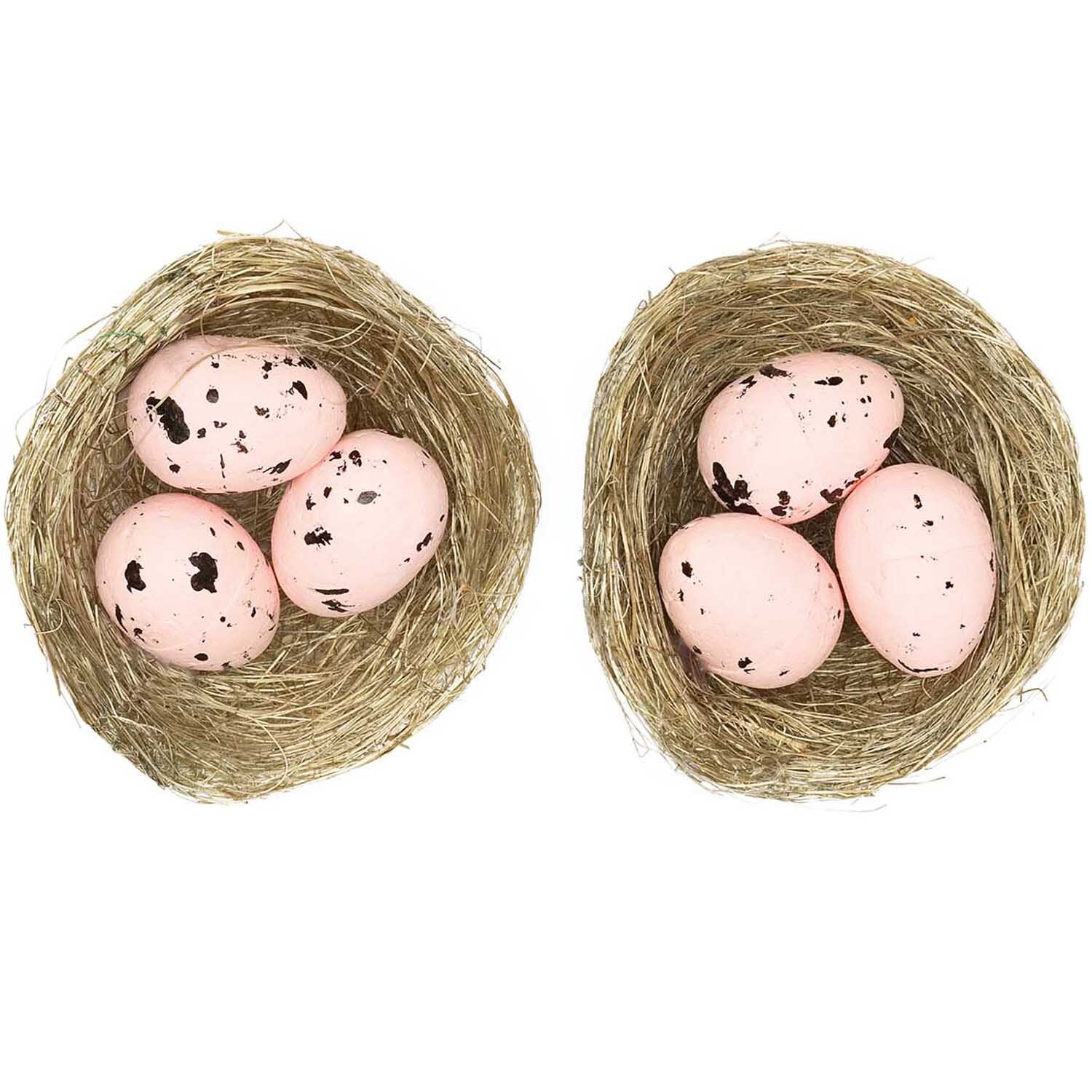 Naturnest mit Eiern rosa 6,5cm 2 Stück von Rico Design zeigt zwei Nester mit rosa Eiern auf weißem Hintergrund.