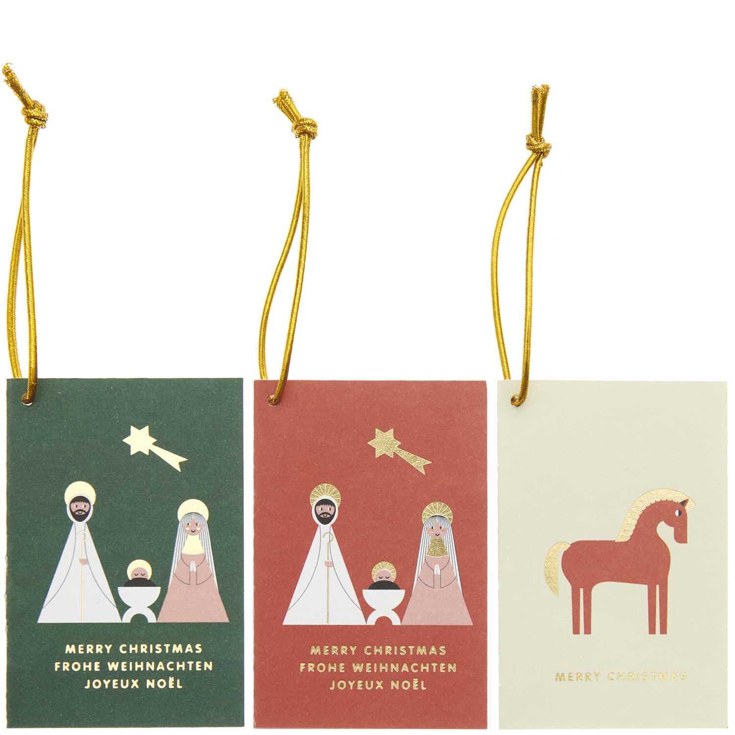 Paper Poetry Kärtchenanhänger Holy Family 6 Stück von Rico Design zeigen weihnachtliche Motive mit goldenen Sternen und Figuren auf farbigen Karten.