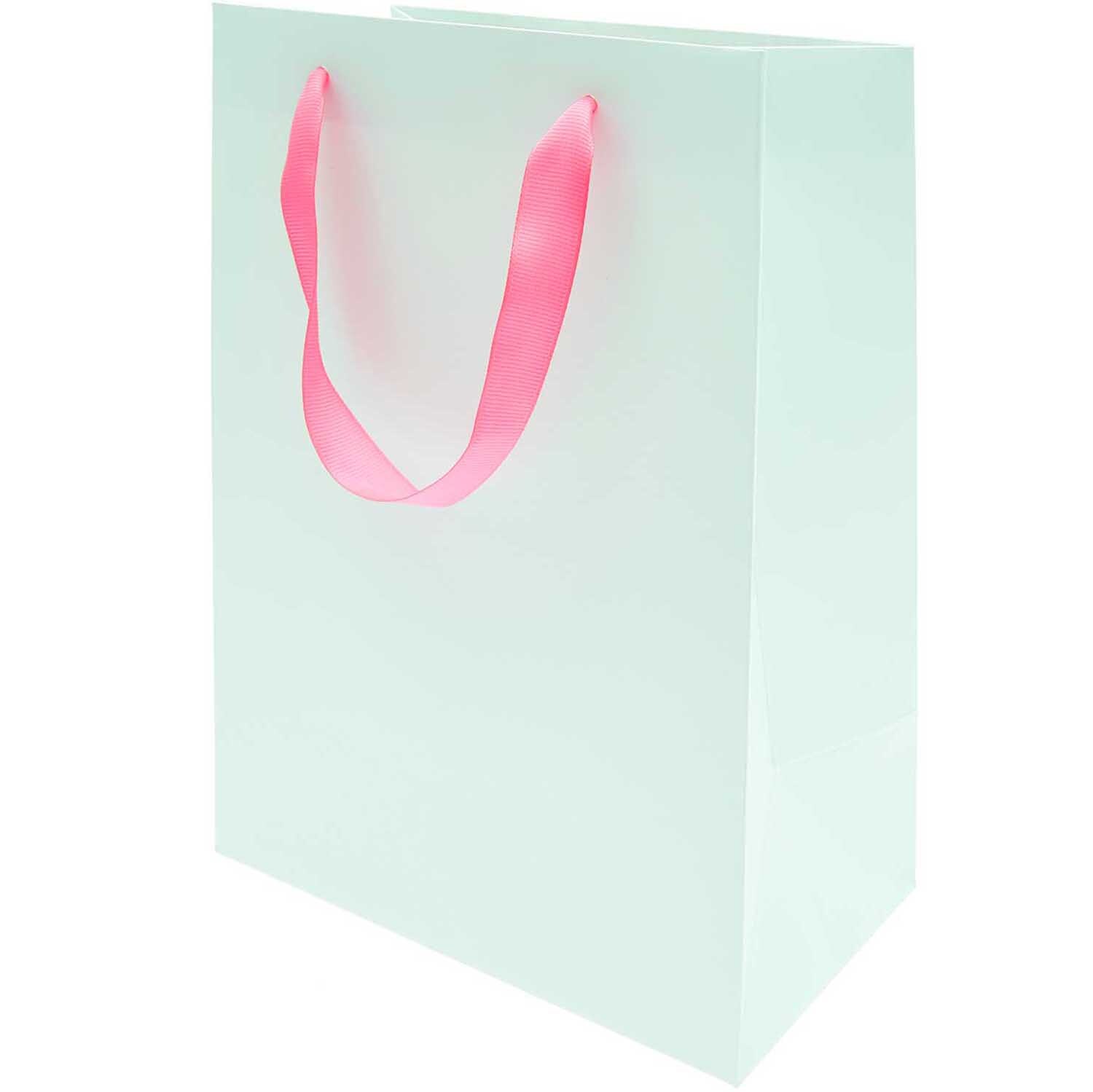 Paper Poetry Geschenktüte in zartem Mint mit rosa Griffen, ideal für stilvolle Geschenke.
