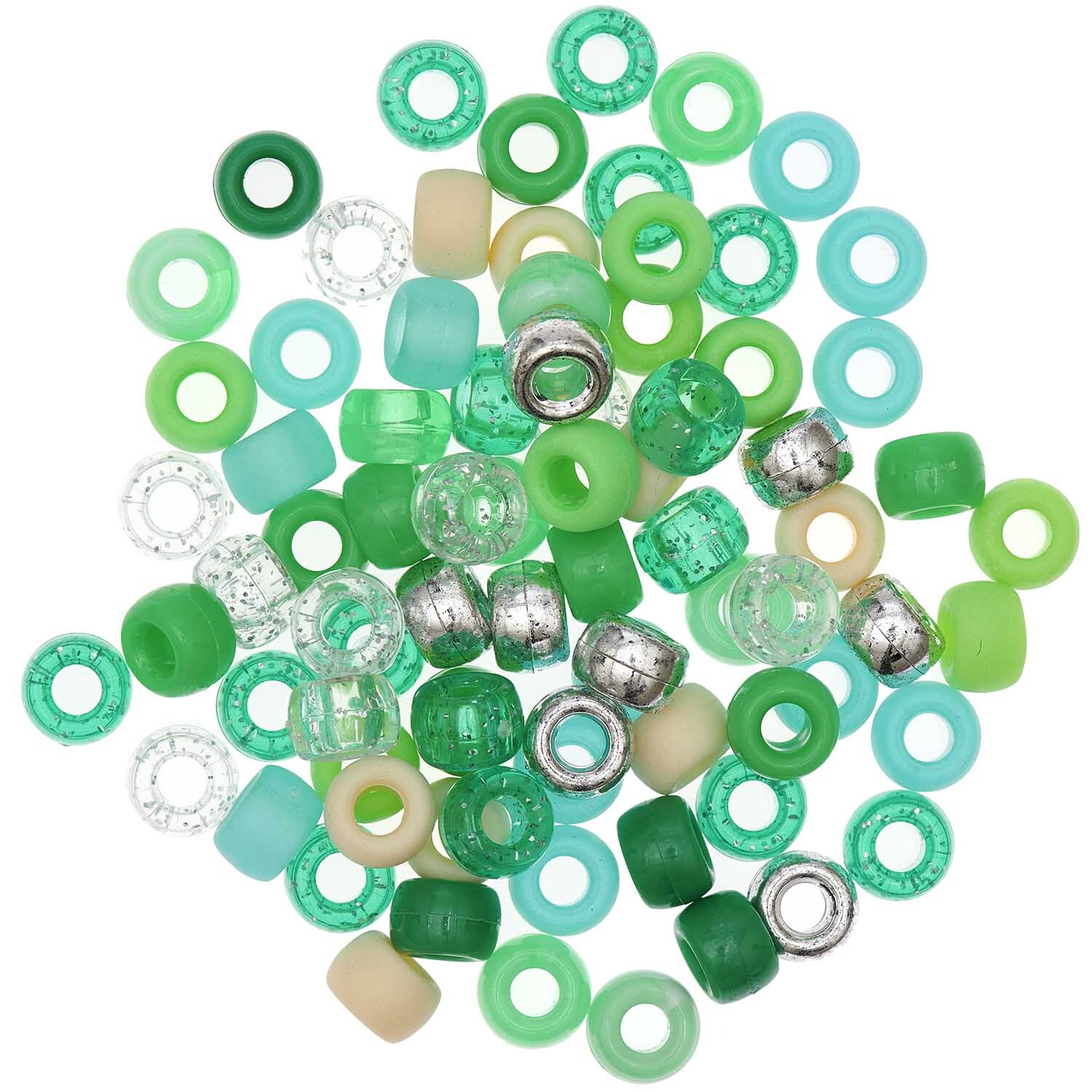 itoshii - Ponii Beads Grün Mix 9x6mm 80 Stück von Rico Design itoshii - Ponii Beads Grün Mix 9x6mm 80 Stück, bunte Perlen von Rico Design in verschiedenen Grüntönen und Silber, ideal für kreative Bastelprojekte.
