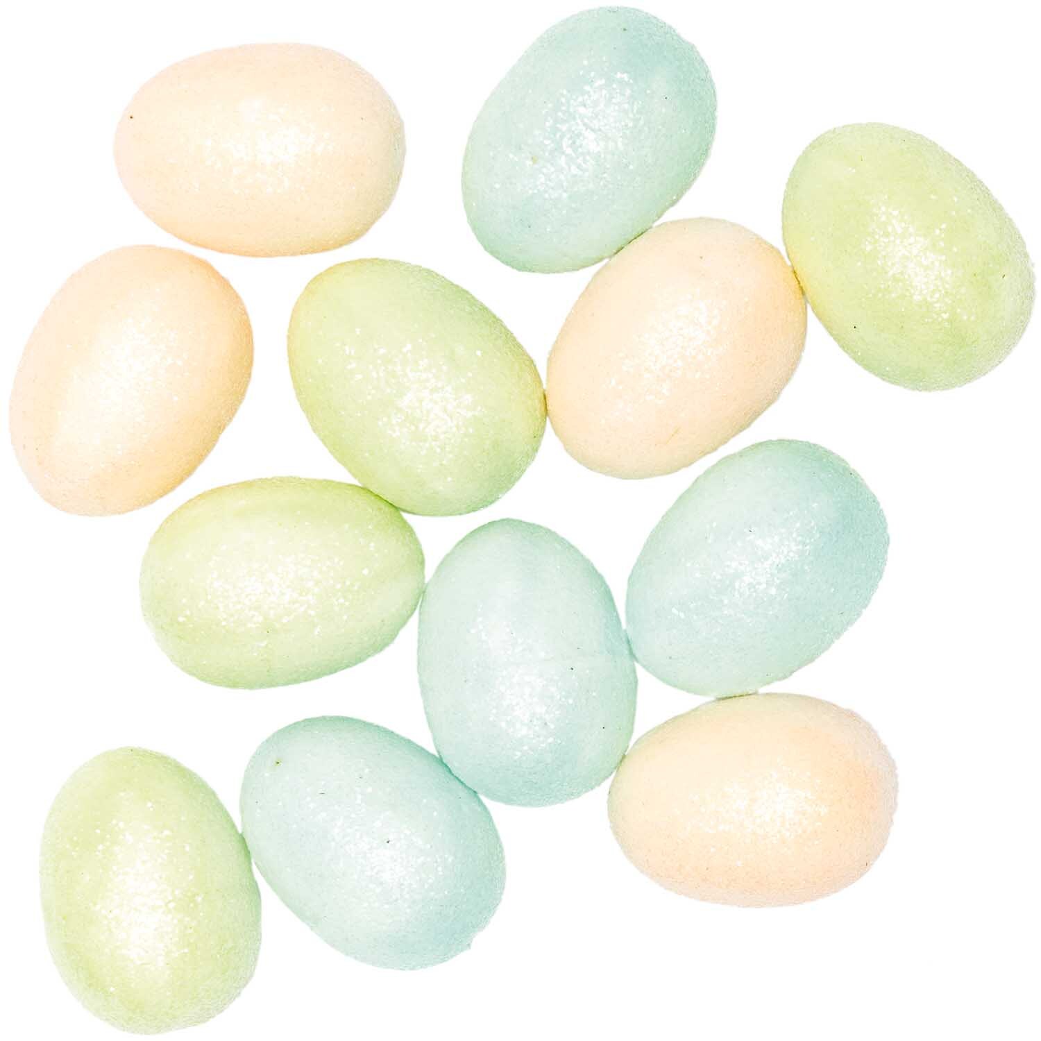 Glitter-Eier pastell 5cm 12 Stück von Rico Design in sanften Pastelltönen, ideal für Dekorationen.