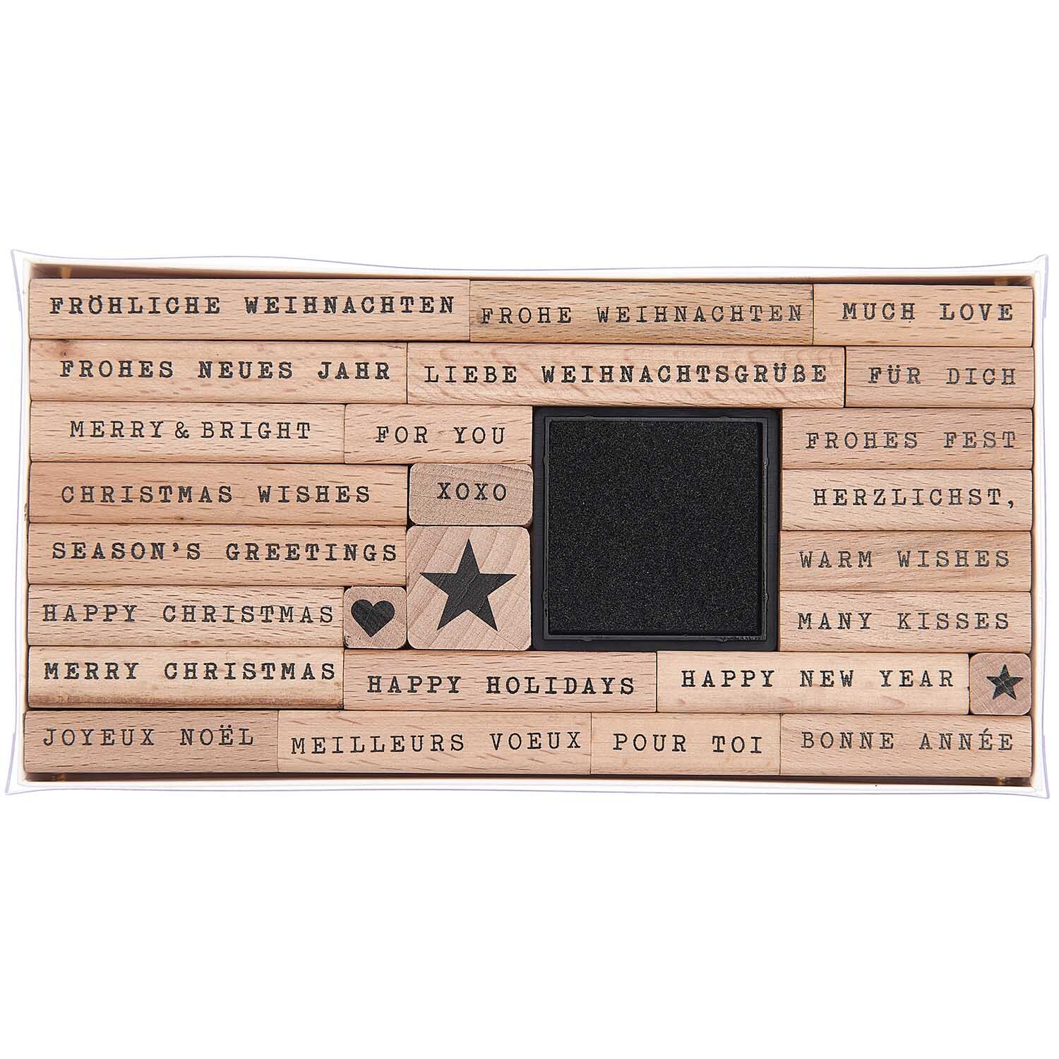 Paper Poetry XL Stempelset Merry Christmas Typewriter: 27-teiliges Set mit festlichen Holzstempeln und schwarzem Stempelkissen. Ideal für kreative Weihnachtsgrüße.