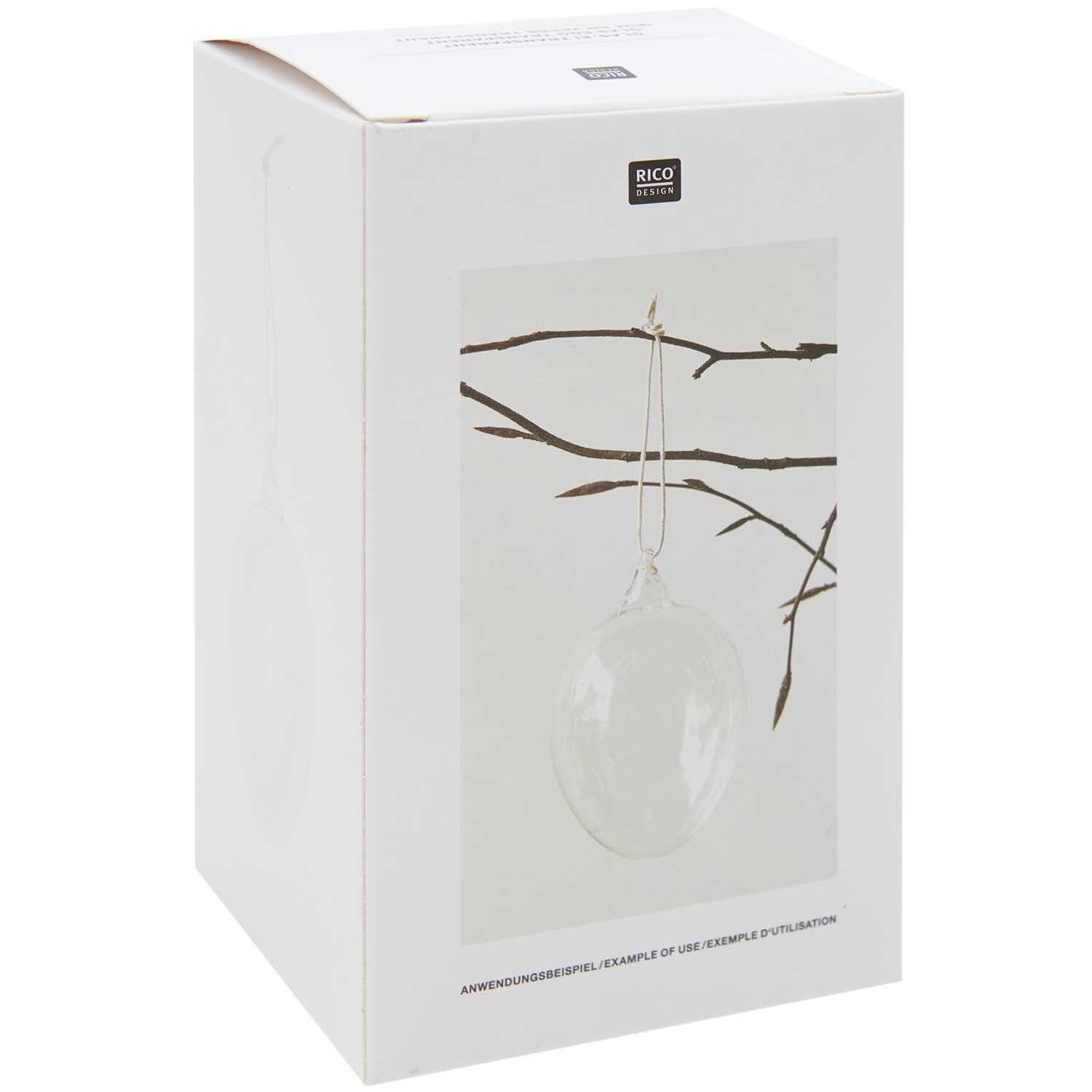Glas Ei transparent Ø 7cm von Rico Design Glas Ei transparent Ø 7cm von Rico Design, hängend an einem Ast, in einer schlichten Verpackung.