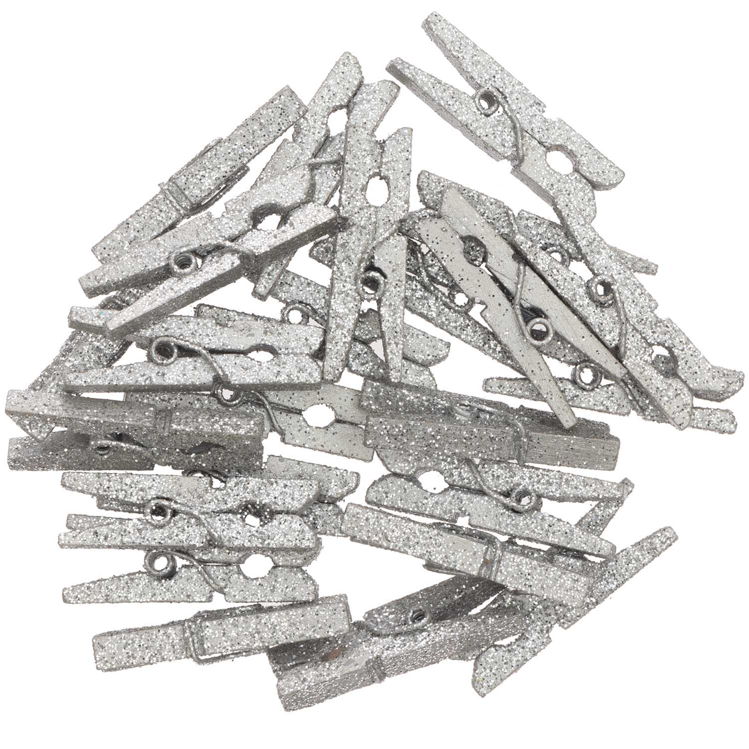Holzklammern mit Glitter 4x30mm 24 Stück Farbe Silber von Rico Design Holzklammern mit Glitter 4x30mm 24 Stück von Rico Design in Silber, dekorativ und vielseitig einsetzbar. Ideal für kreative Bastelprojekte.