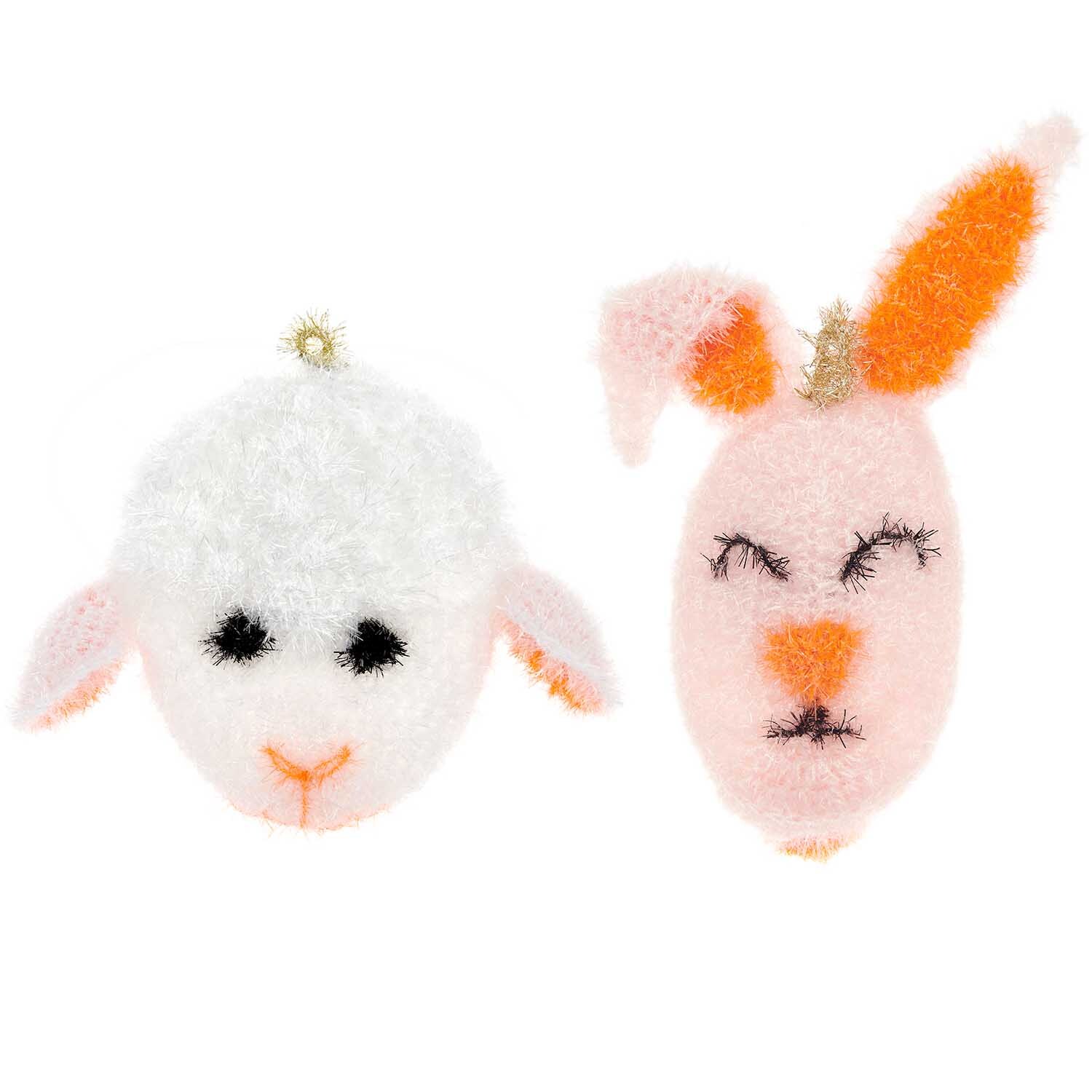 Häkelset Creative Bubble Häschen + Lamm: Zwei gehäkelte Figuren, ein weißes Lamm und ein rosa Häschen, von Rico Design.