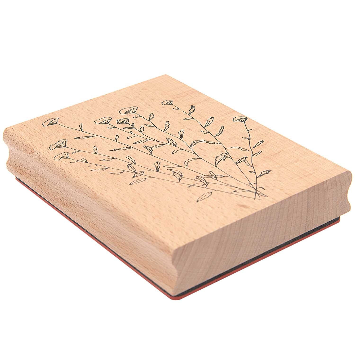 Paper Poetry Stempel Anis 9x12x2cm zeigt ein florales Muster auf hellem Holz. Ideal für kreative Bastelprojekte.