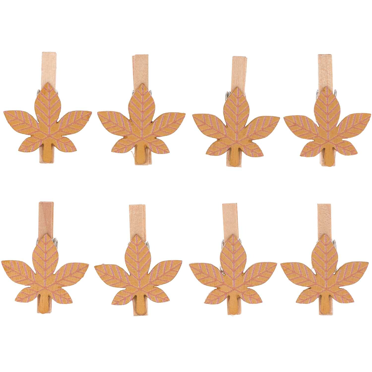 Holzclips Blatt 3cm, 8 Stück von Rico Design, zeigen braune Blattformen auf Holzklammern.