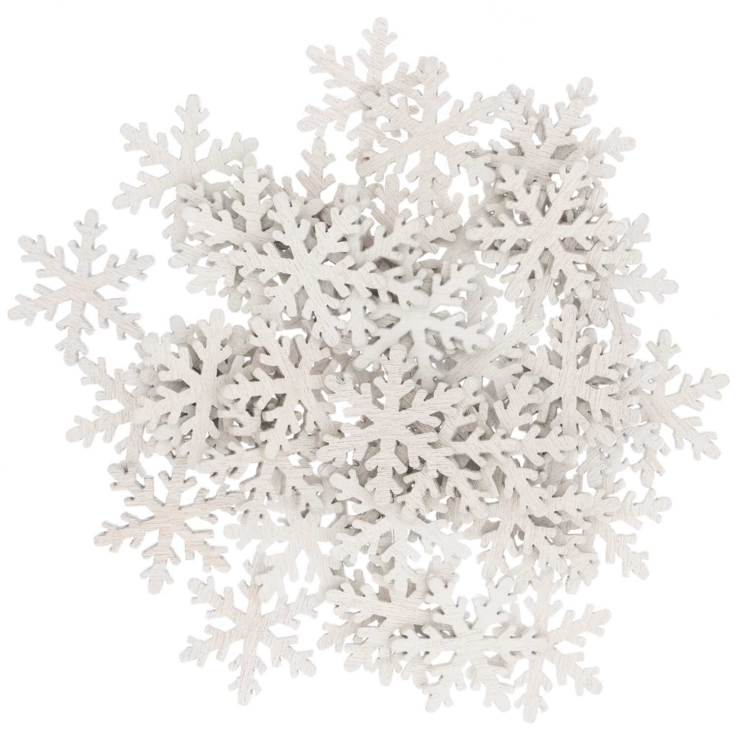 Holzstreu Schneeflocke weiß 20x23mm von Rico Design, dekorative Schneeflocken für Bastelprojekte.