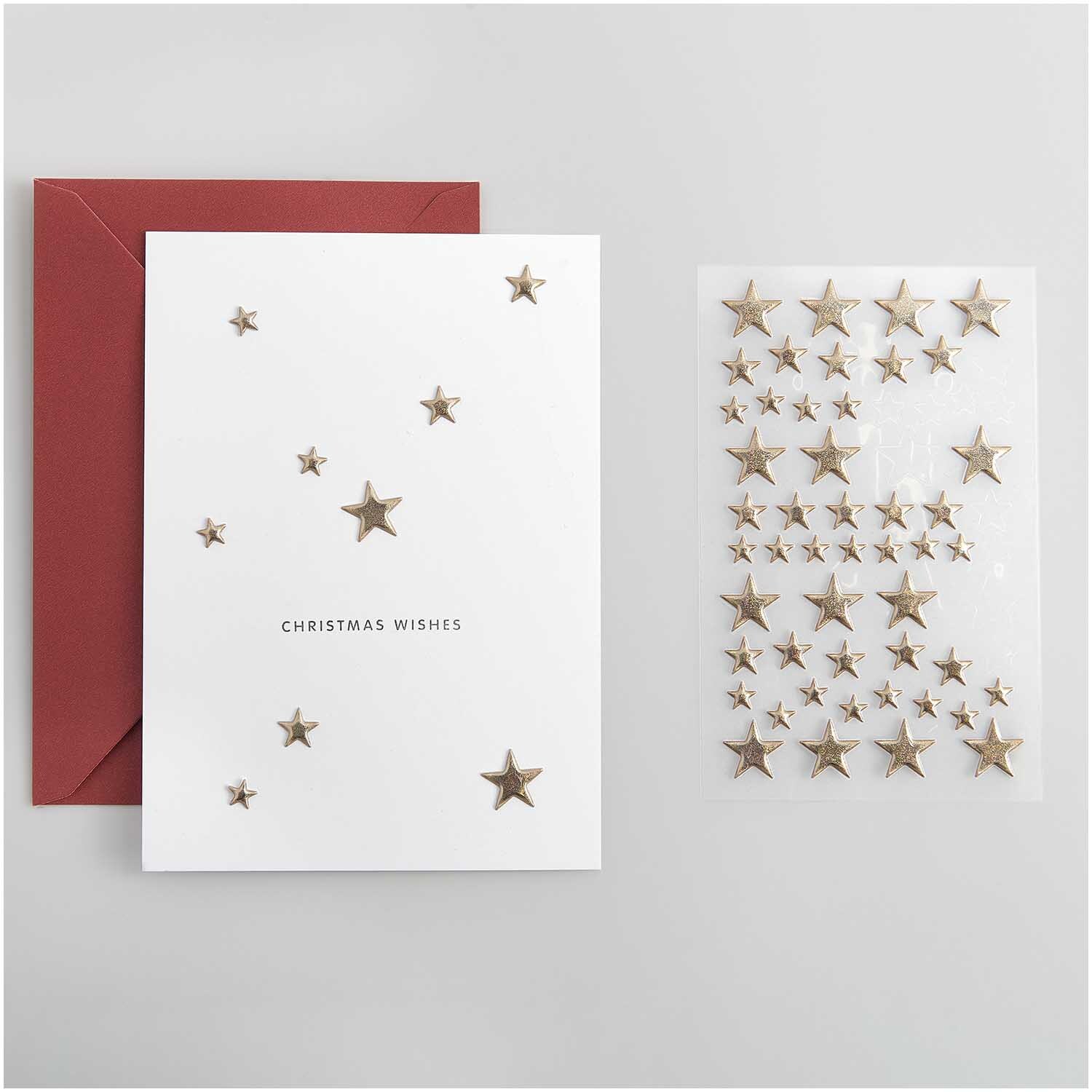 Paper Poetry Puffy-Sticker Sterne gold 58 Stück von Rico Design Paper Poetry Puffy-Sticker Sterne gold 58 Stück von Rico Design, dekoriert auf einer weißen Karte mit rotem Umschlag.