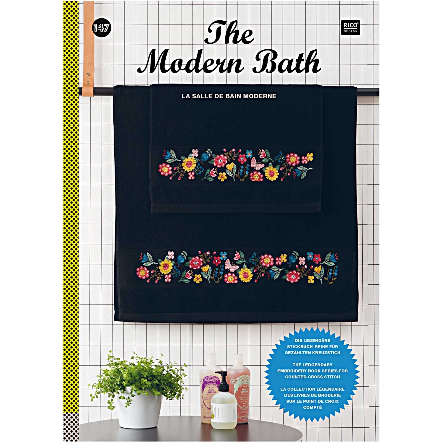 Stickbuch The modern Bath Nr.147 zeigt ein schwarzes Handtuchset mit bunten Blumenstickereien.