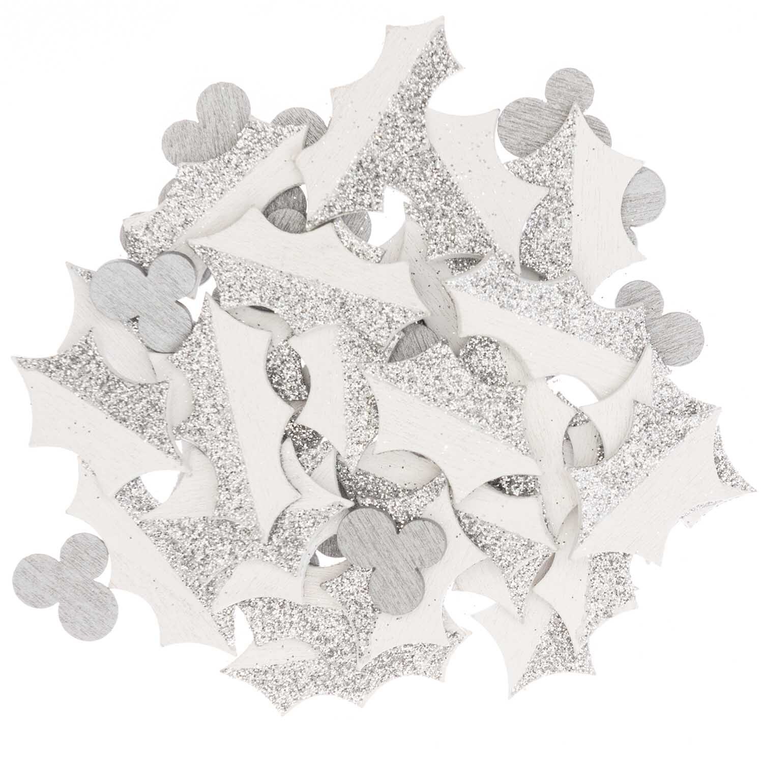 Holzstreu Ilex weiß 48 Stück von Rico Design zeigt weiße, glitzernde Blätter und Formen. Ideal für kreative Dekorationen.
