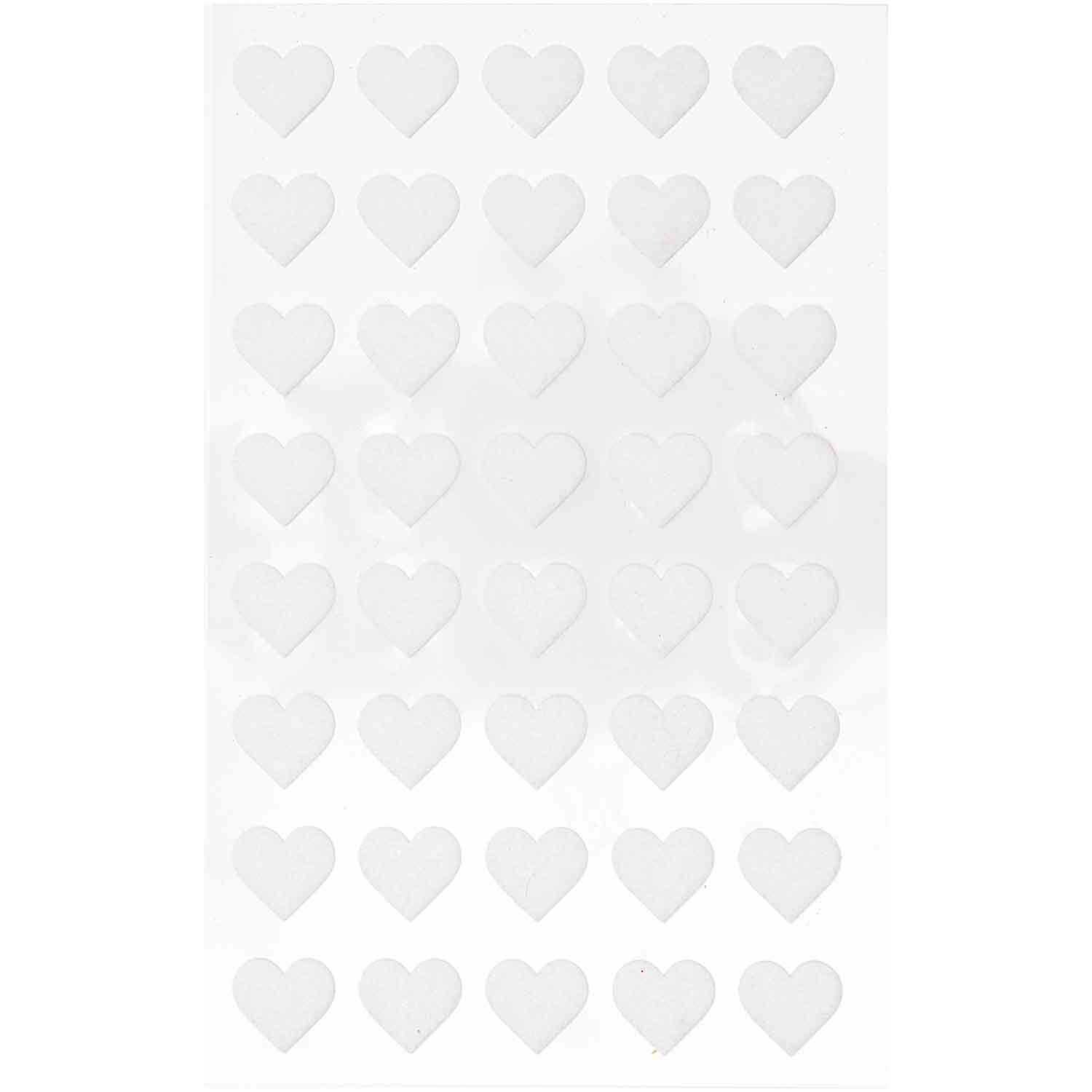 Paper Poetry Filzsticker Herzen klein 1 Blatt zeigt weiße Herzsticker von Rico Design auf einem Blatt. Ideal für kreative Projekte.