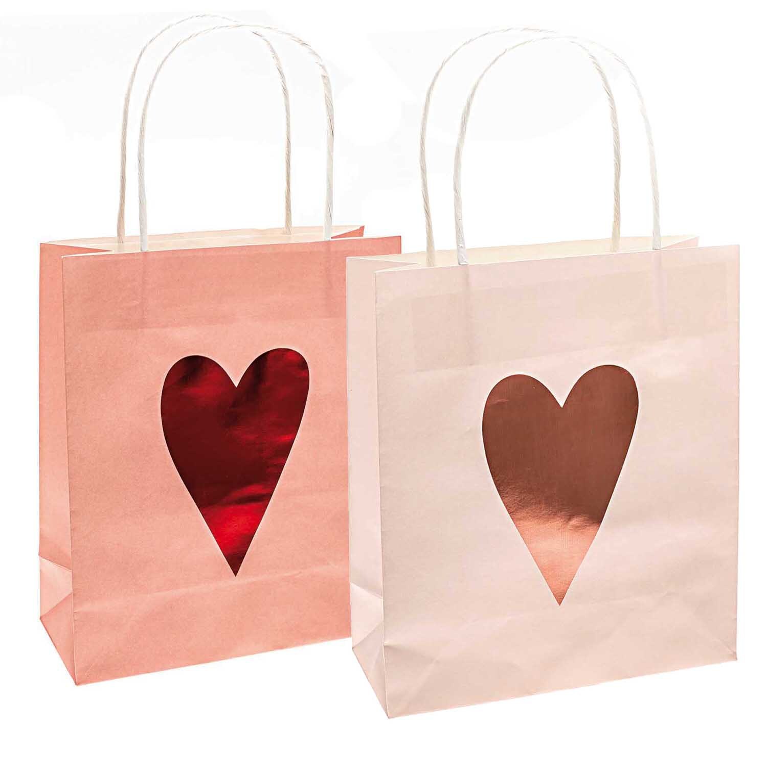 Paper Poetry Papiertüten It must be love Herzen rosa-rot 2 Stück von Rico Design Paper Poetry Papiertüten mit Herzmotiv in rosa und rot, ideal für Geschenke, 2 Stück.