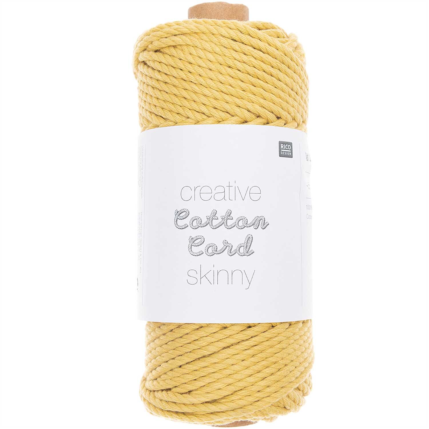 Creative Cotton Cord skinny Makramee-Garn in Gelb von Rico Design, 190g, 55m, aufgerollt auf einer Spule.