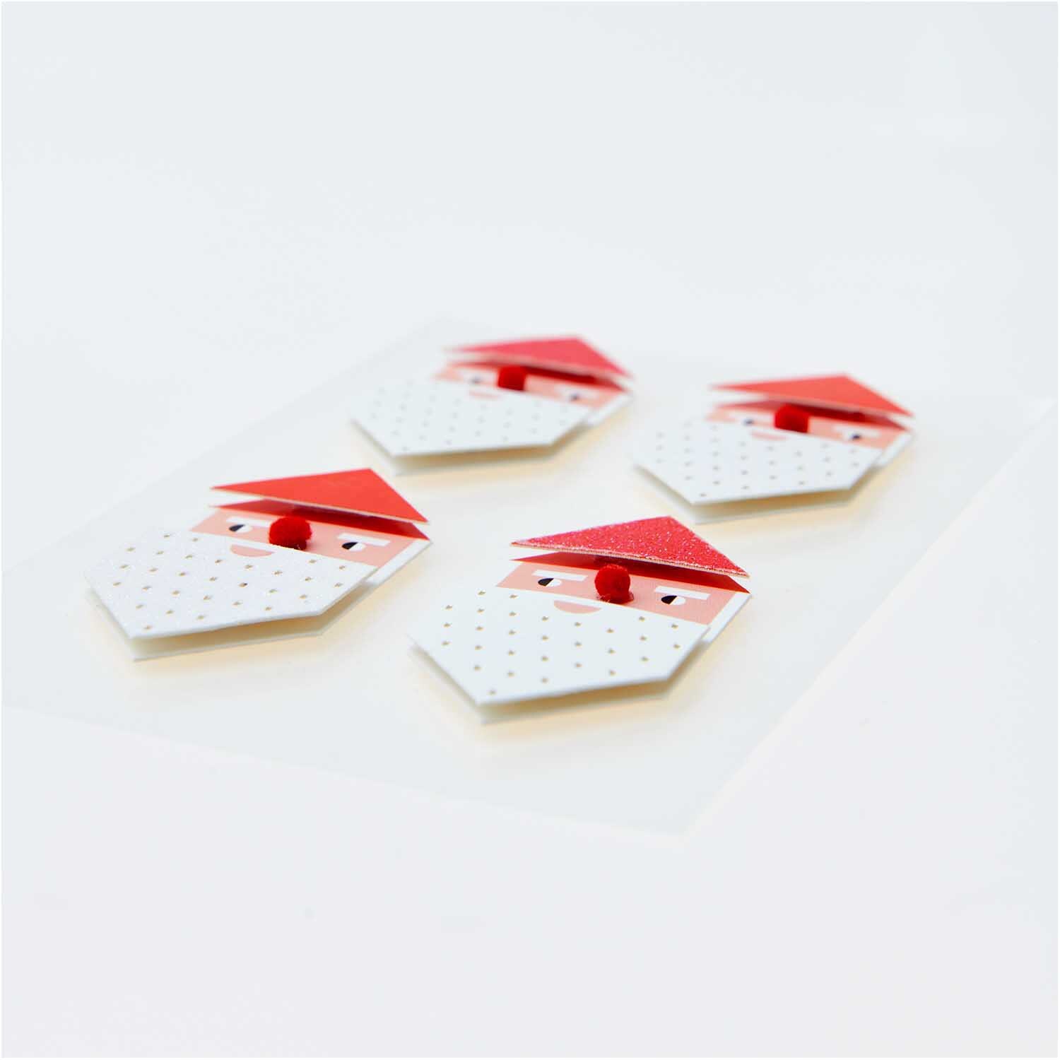 Paper Poetry 3D Sticker Weihnachtsmann von Rico Design Paper Poetry 3D Sticker Weihnachtsmann zeigt vier stilisierte Weihnachtsmann-Gesichter mit roten Mützen und weißen Bärten.