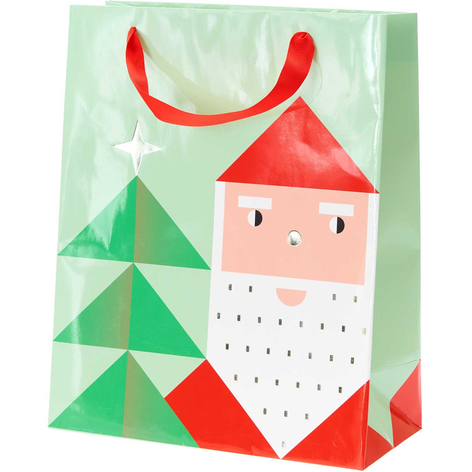 Paper Poetry Geschenktüte Weihnachtsmann mit rotem Henkel und grünem Tannenbaum-Motiv.
