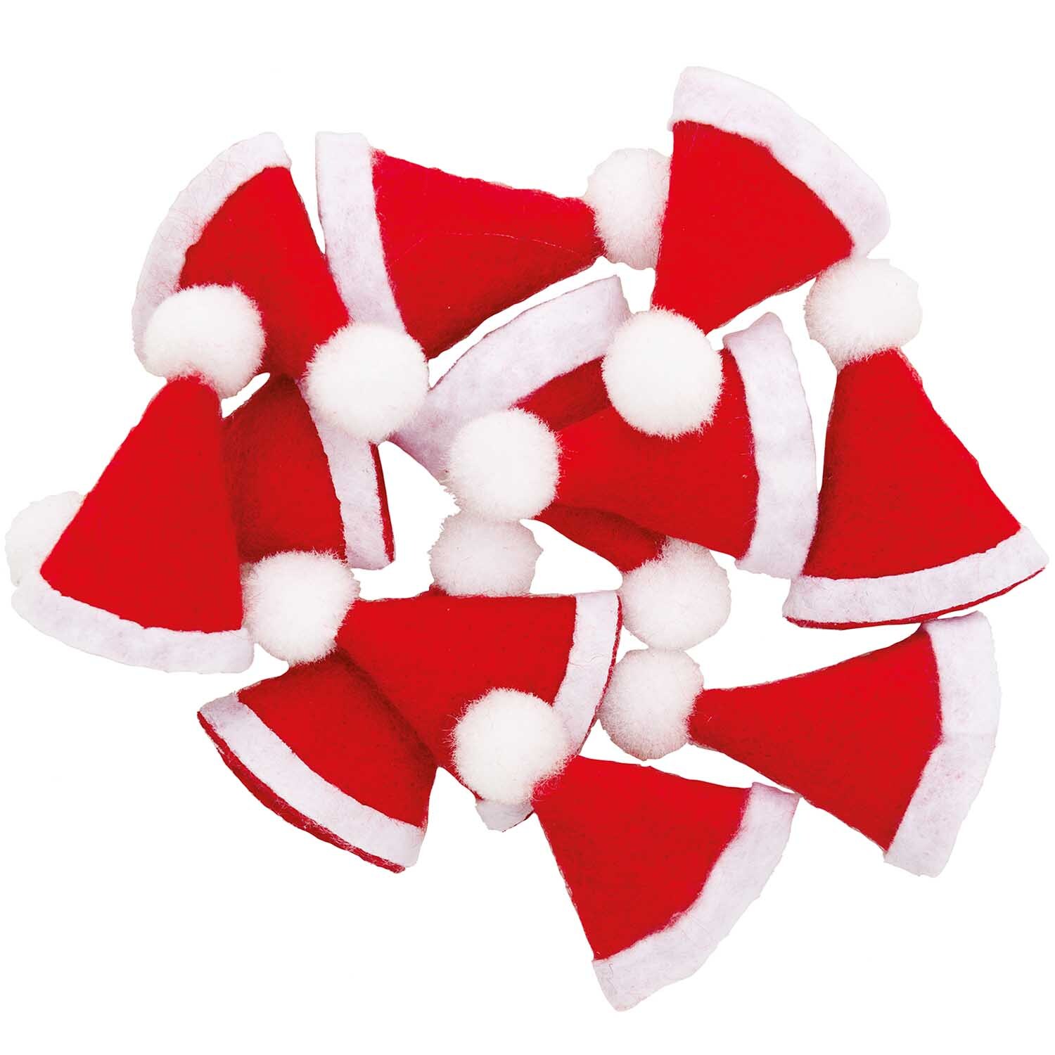 Mini-Weihnachtsmützen in Rot von Rico Design, 12 Stück, mit weißen Bommel-Details auf schwarzem Hintergrund.