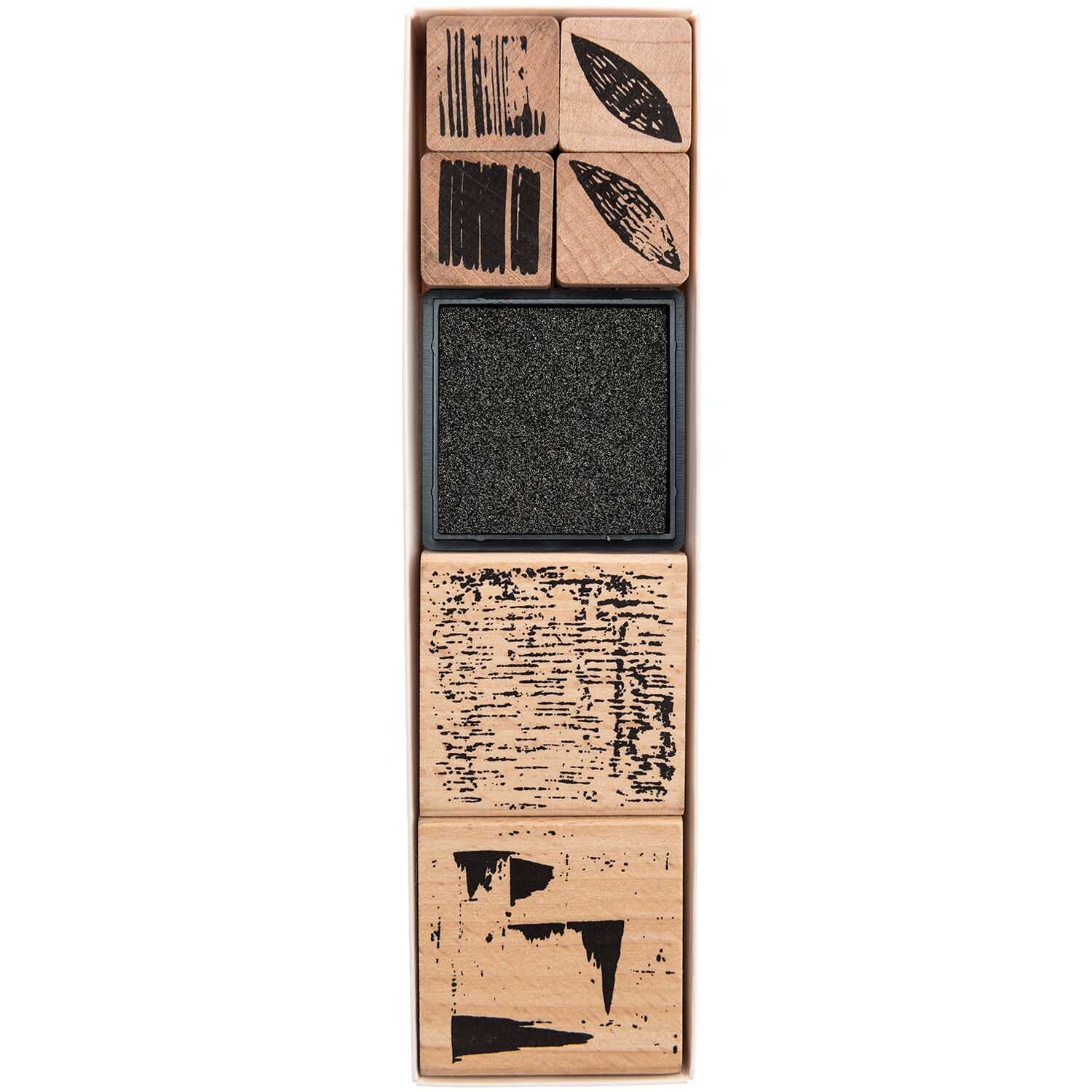 Paper Poetry Stempelset Struktur, 7-teilig, zeigt verschiedene Holzstempel mit einzigartigen Mustern. Ideal für kreative Projekte und Bastelarbeiten.