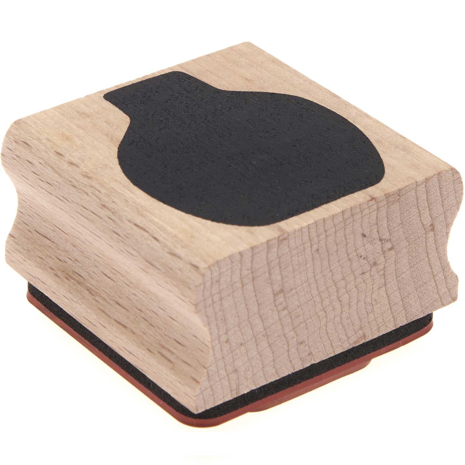 Paper Poetry Stempel Blumenvase 4x4cm von Rico Design zeigt eine schwarze Blumenvase auf Holz.