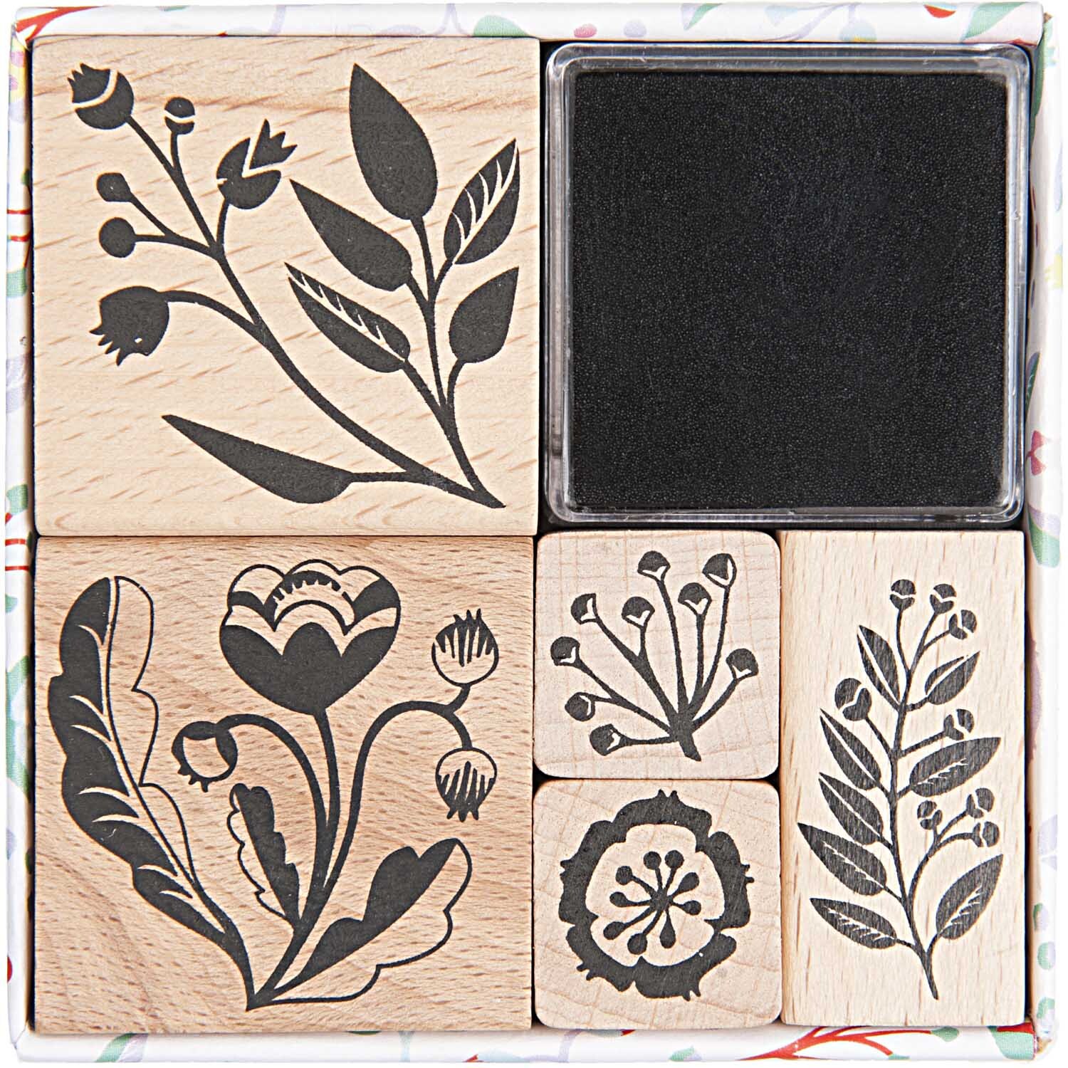 Paper Poetry Stempelset Romantic Flowers: Sechs Holzstempel mit floralen Motiven und schwarzem Stempelkissen. Ideal für kreative Projekte.