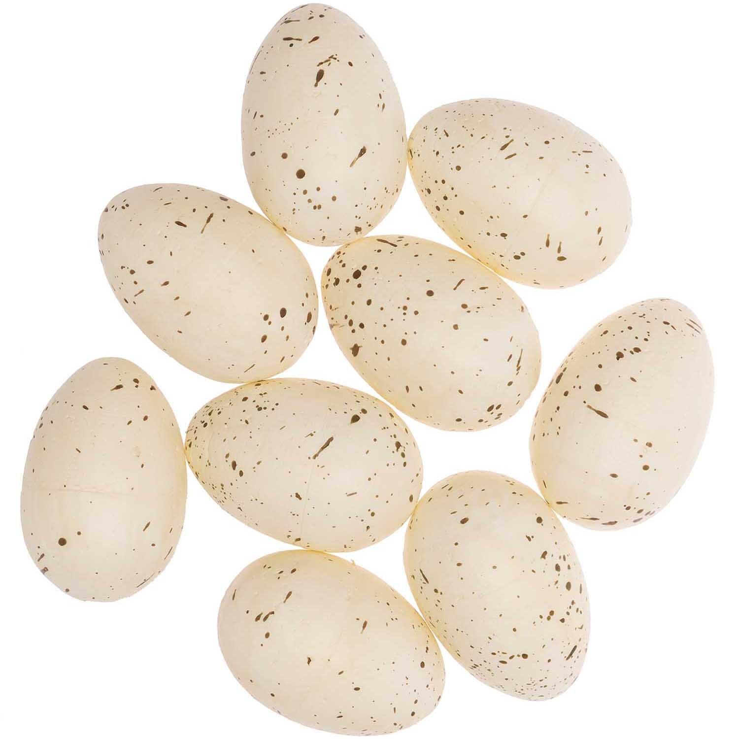 Eier im Netz 6cm 9 Stück von Rico Design: Neun cremefarbene, gesprenkelte Deko-Eier in einem Netz arrangiert.