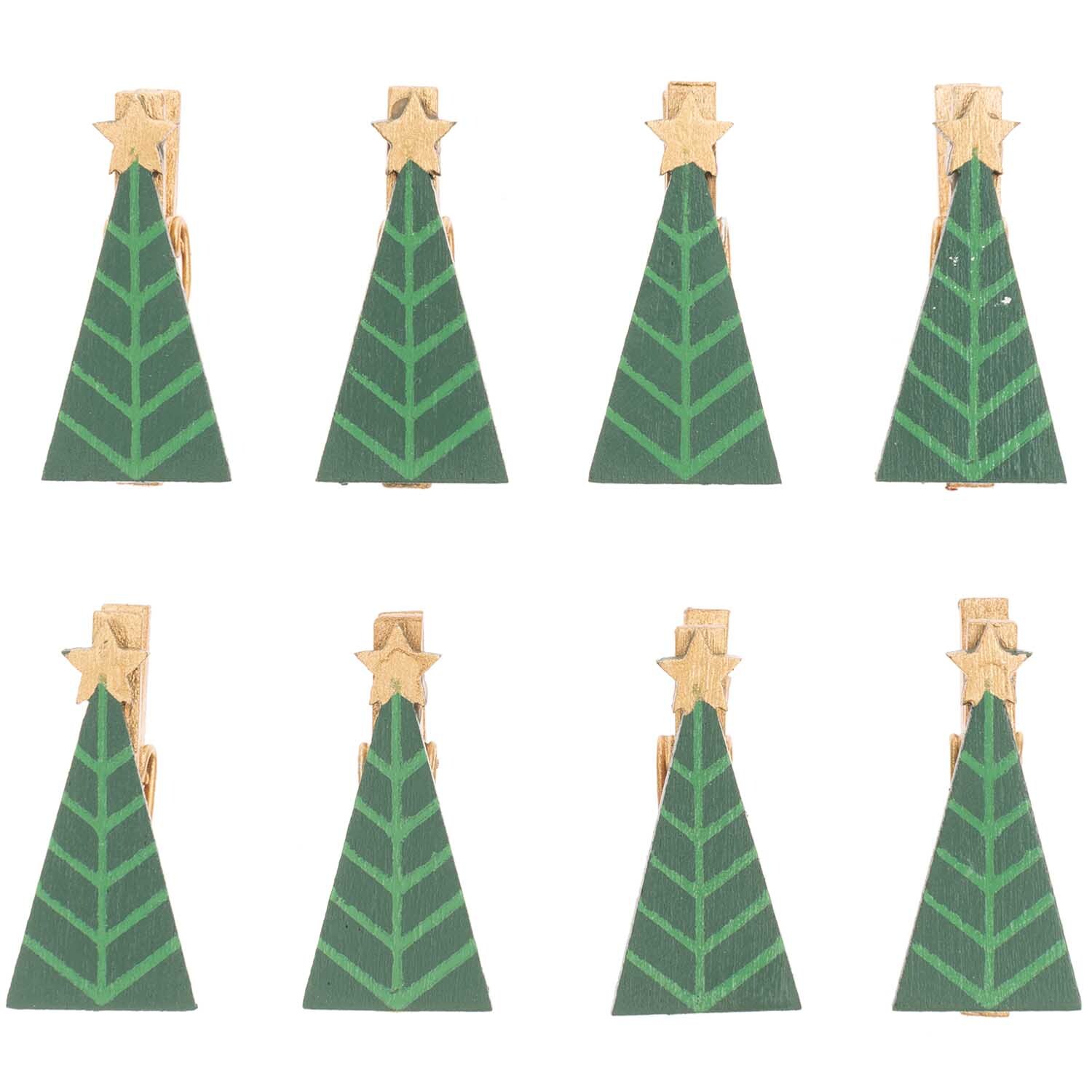 Dekoklammern Tannenbaum in grün-gold von Rico Design, 3 cm, 8 Stück, auf schwarzem Hintergrund.