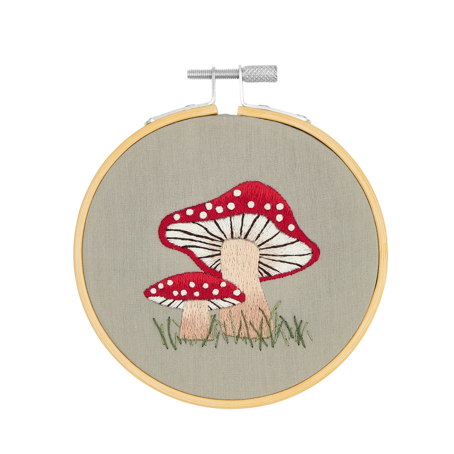 Stickpackung Shrooom kleine Pilze vorgezeichnet: Zwei rote Pilze auf grauem Stoff, Ø10cm, von Rico Design.