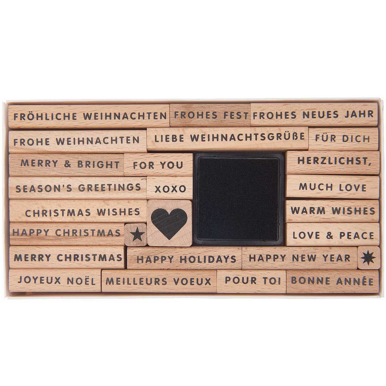 Paper Poetry XL Stempelset Merry Christmas, 27-teilig, mit verschiedenen Weihnachtsgrüßen in mehreren Sprachen und einem Herzmotiv.