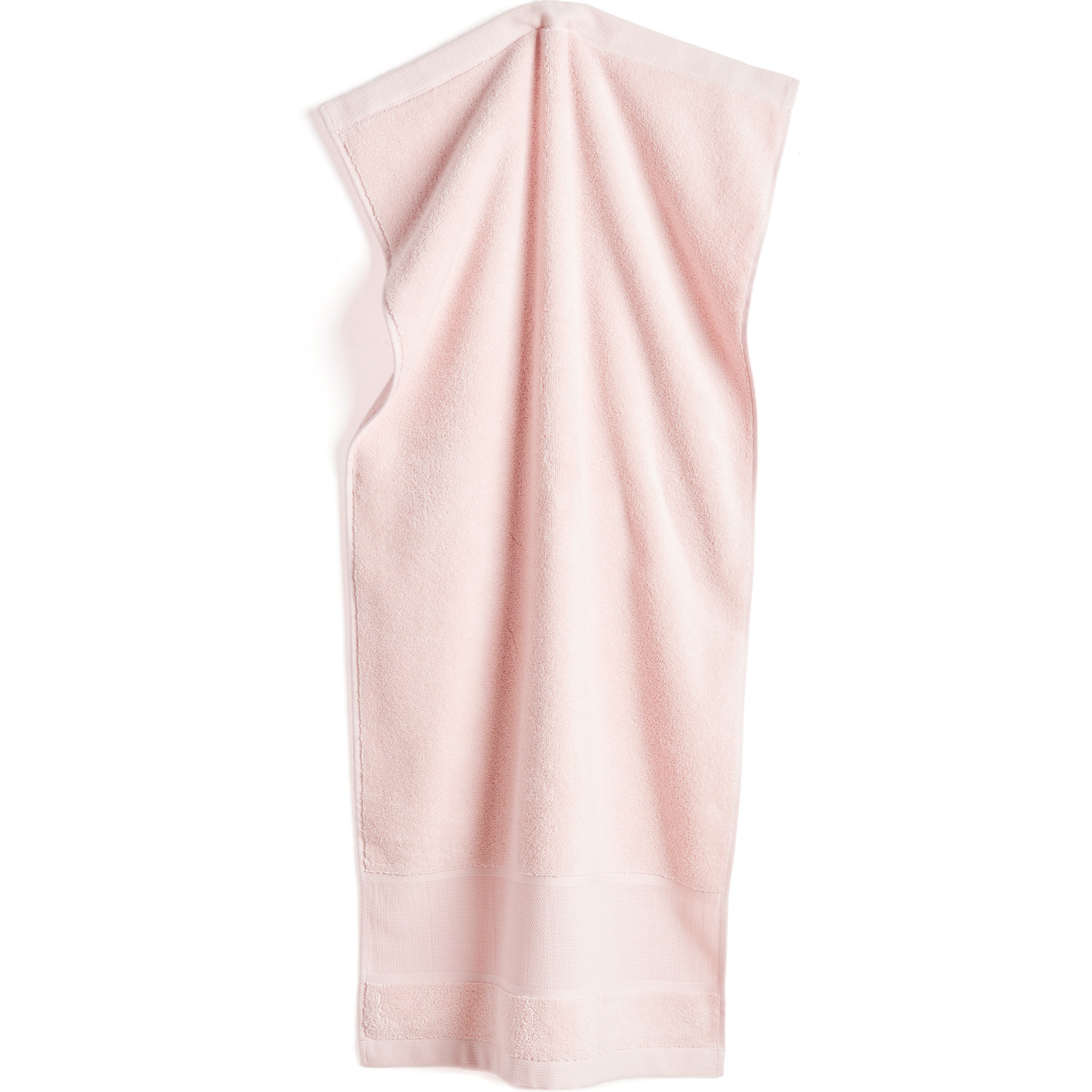 Serviette de bain 50x100cm, GOTS Couleur Rose pastel from Rico Design Handtuch in Pastellrosa von Rico Design, 50x100cm, GOTS-zertifiziert, auf weißem Hintergrund.