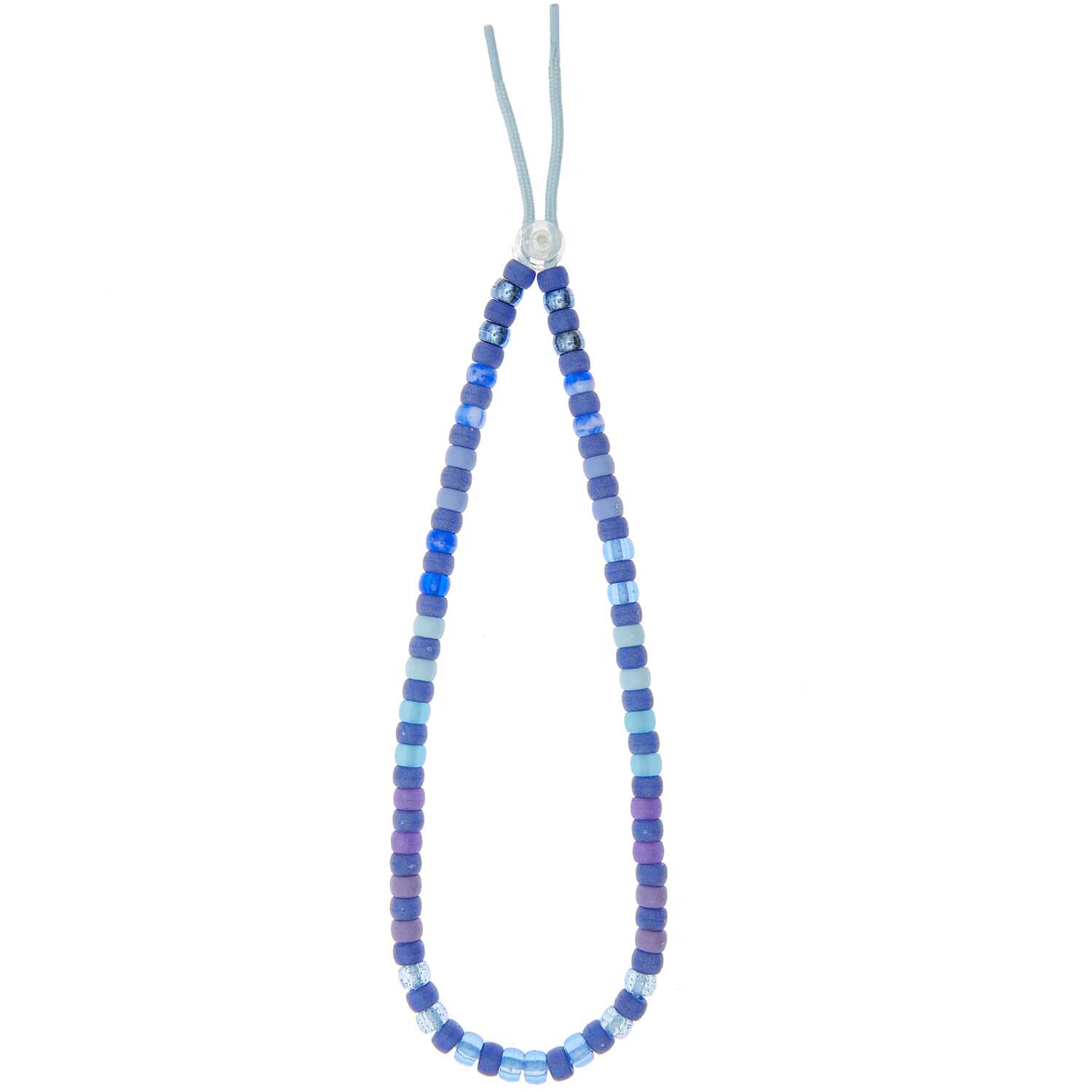 itoshii - Ponii Beads Blau Mix 9x6mm 80 Stück von Rico Design Itoshii - Ponii Beads: Eine Kette aus blauen Perlen in verschiedenen Tönen von Rico Design.