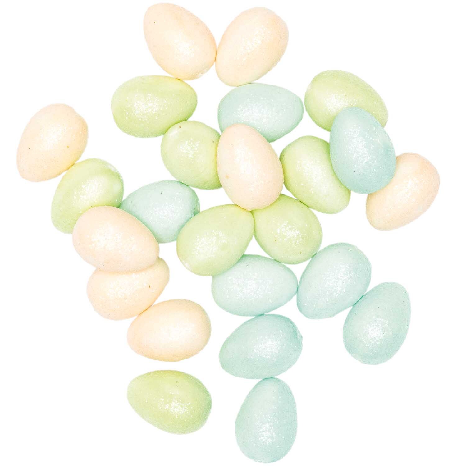 Glitter-Eier pastell 4cm 12 Stück: Pastellfarbene, glitzernde Eier von Rico Design, ideal für Dekorationen.