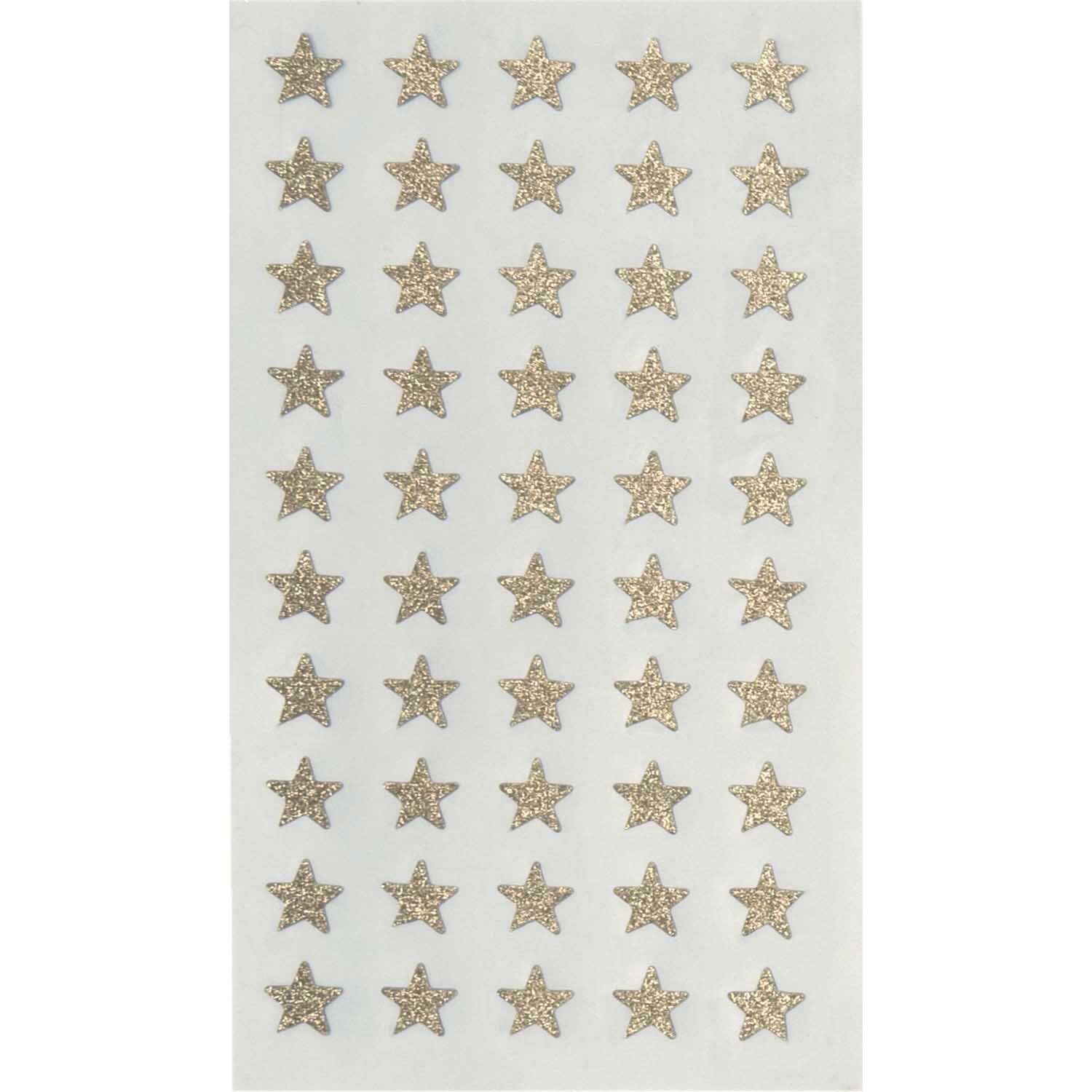 Paper Poetry Sticker Sterne Glitter gold, 4 Blatt von Rico Design. Goldene Sternsticker auf weißem Hintergrund. Ideal für kreative Bastelprojekte.