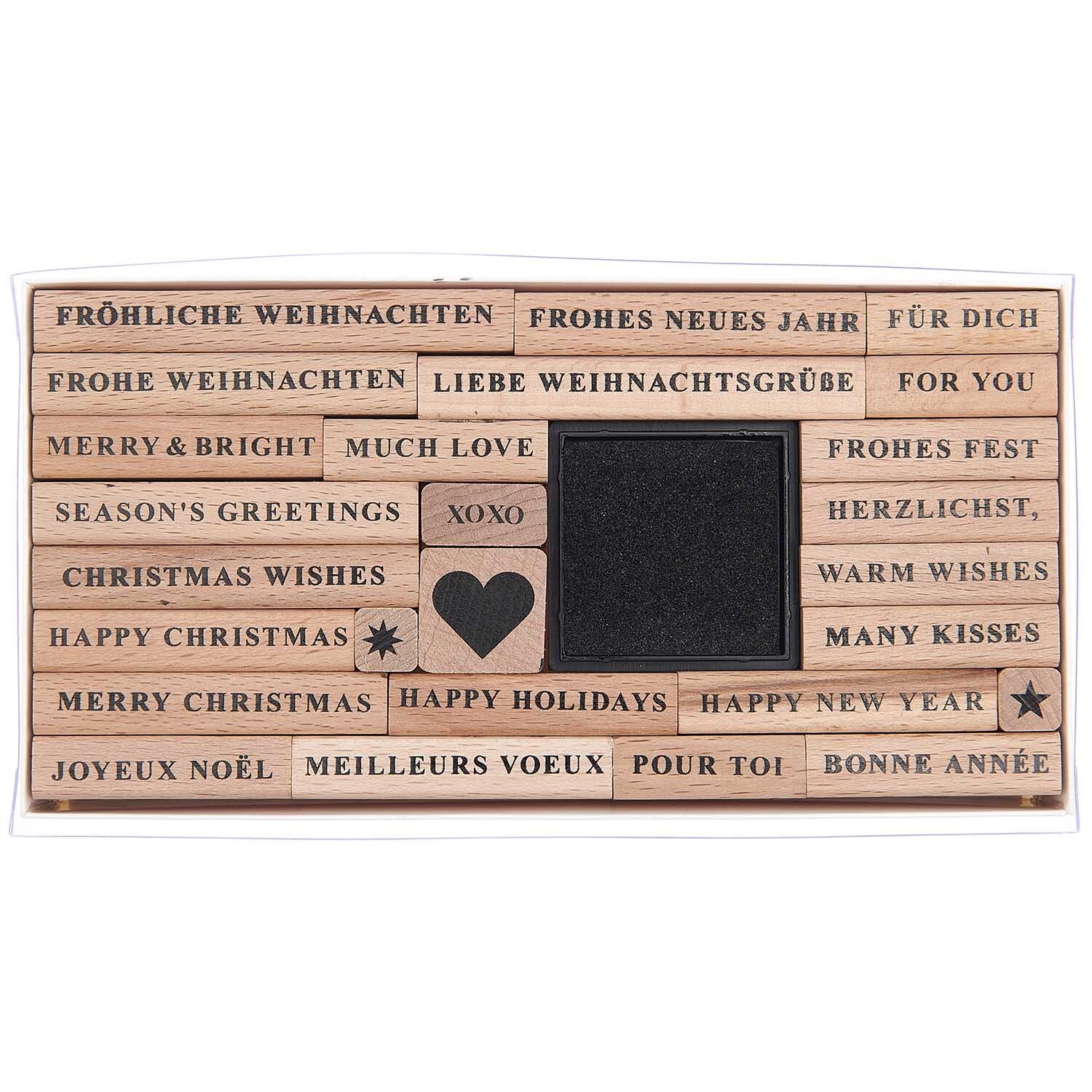 Paper Poetry XL Stempelset Merry Christmas serif, 27-teilig, von Rico Design mit festlichen Grüßen in verschiedenen Sprachen und einem Herzmotiv.