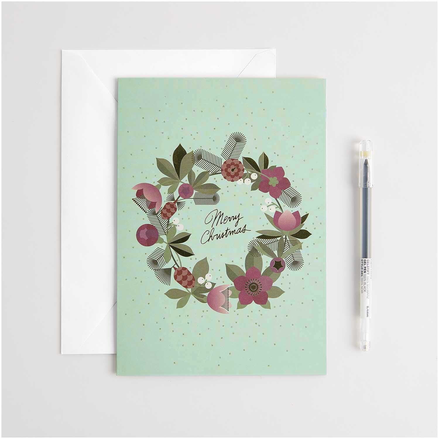 Paper Poetry Kartenset Helleborus A5 16-teilig von Rico Design Paper Poetry Kartenset Helleborus A5 mit floraler Kranzillustration und "Merry Christmas"-Schriftzug, 16-teilig, von Rico Design.