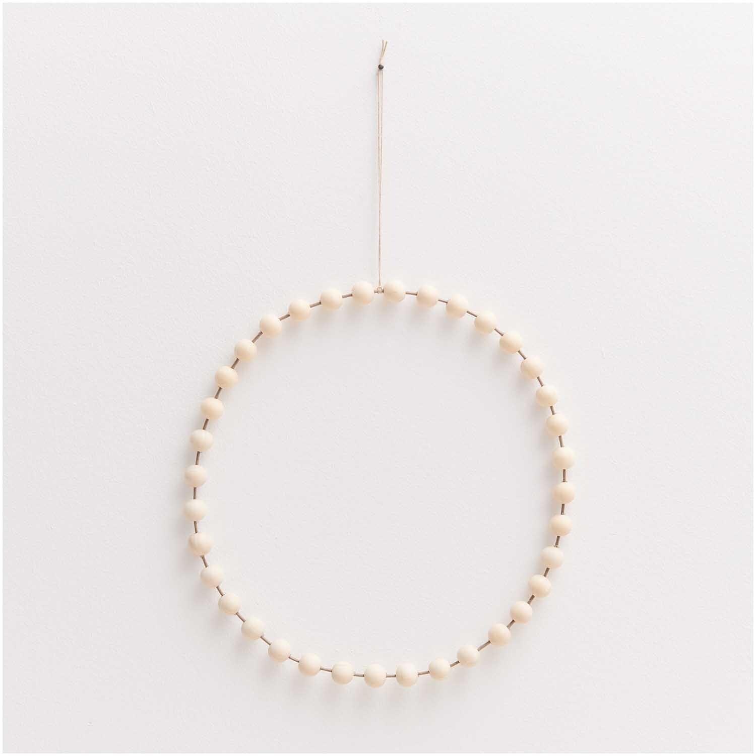 Papierdraht 1,8mm 1m 10 Stück Farbe Taupe von Rico Design Papierdraht 1,8mm 1m 10 Stück von Rico Design in Taupe, geformt zu einem dekorativen Kreis.