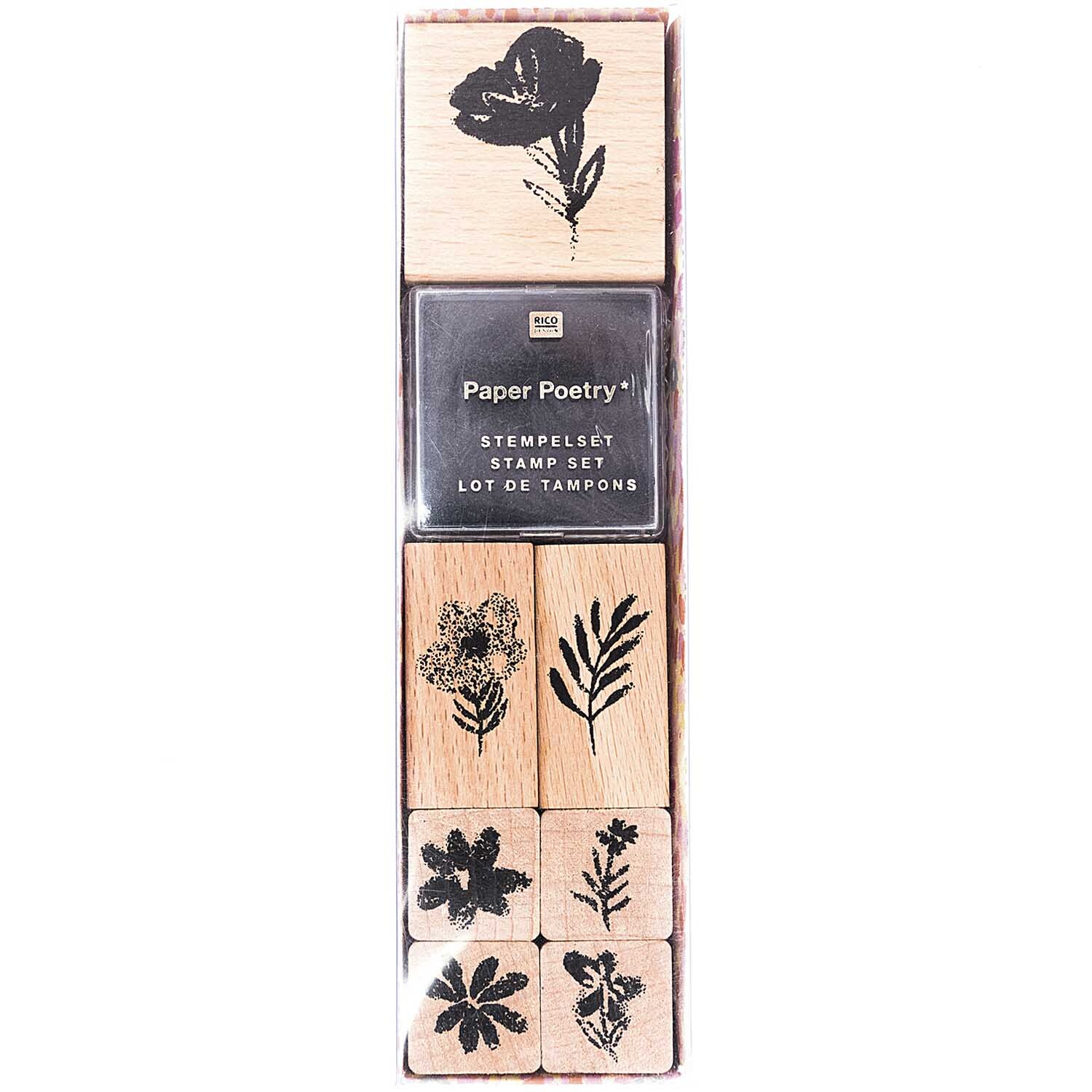 Paper Poetry Stempelset Crafted Nature Blumen, 8-teilig, zeigt florale Motive in Schwarz auf Holzblöcken. Ideal für kreative Bastelprojekte.
