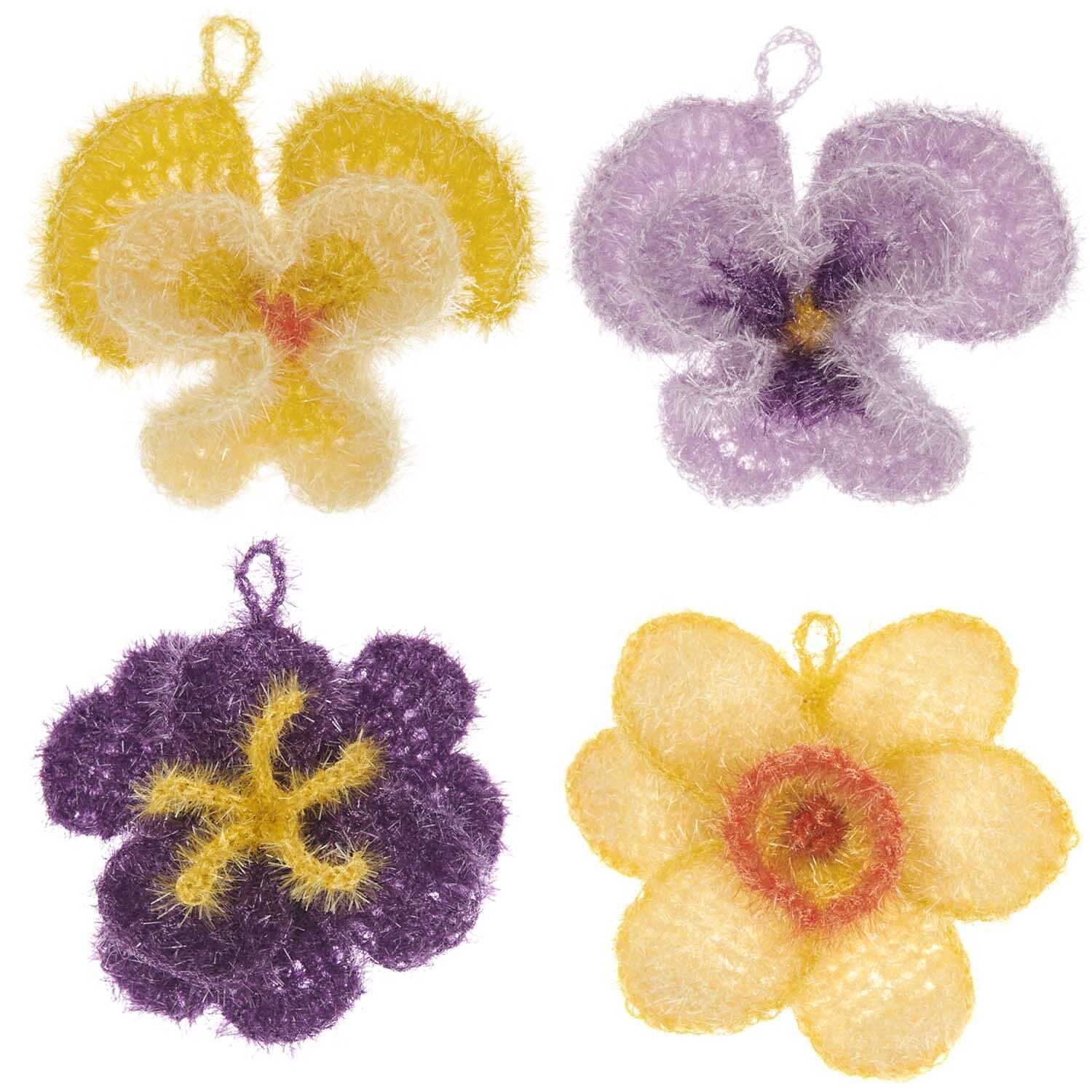 Häkelset Creative Bubble Frühlingsblume von Rico Design zeigt bunte, flauschige Blumen in Gelb, Lila und Orange. Ideal für kreative Projekte.