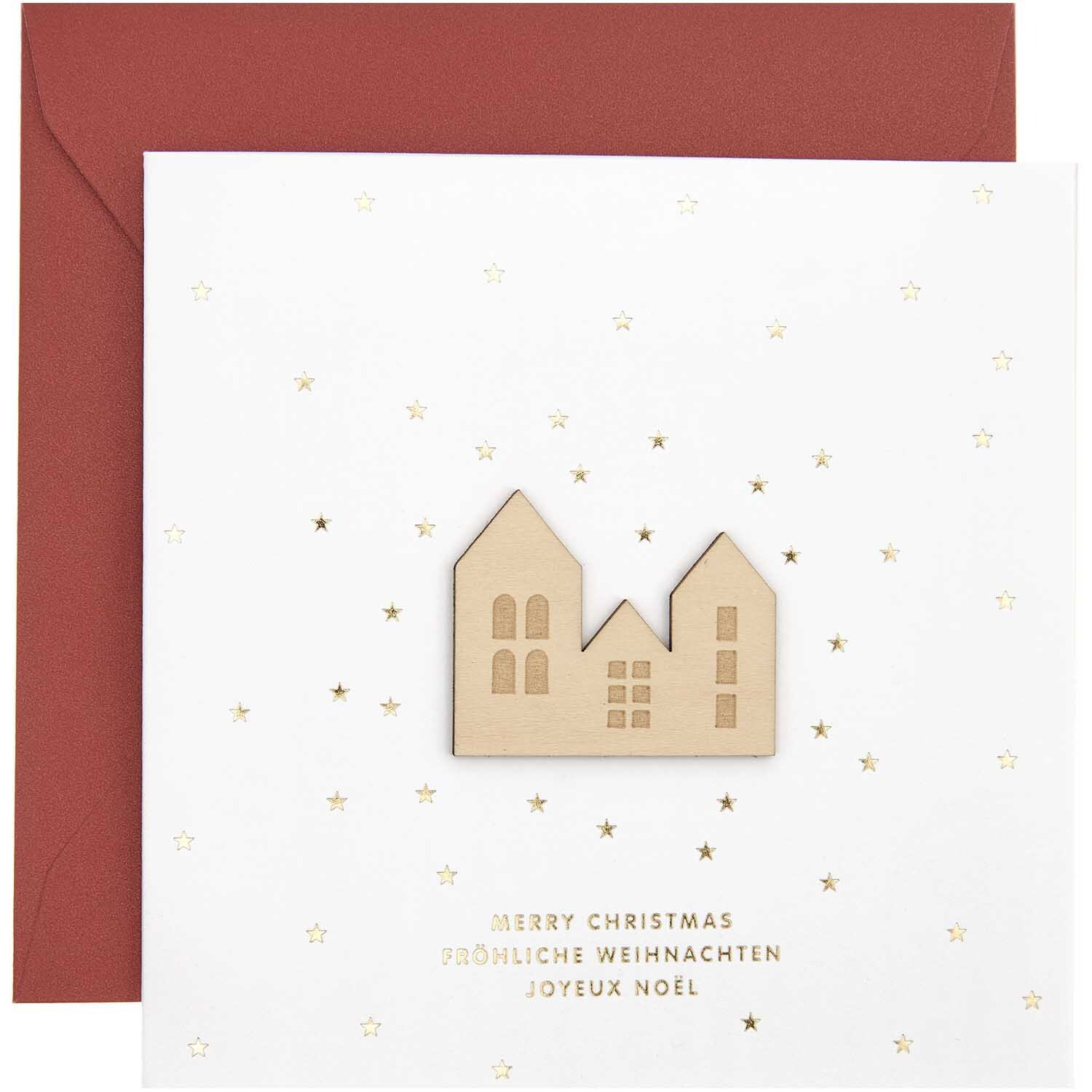Paper Poetry Grußkarte mit Häusern und roten Umschlag, verziert mit goldenen Sternen und Weihnachtsgrüßen.