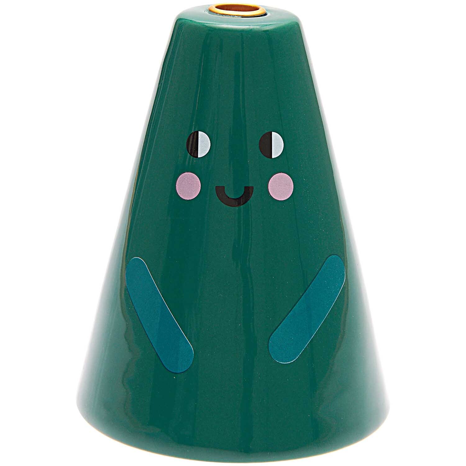 Keramik-Kerzenhalter in Tannenform mit fröhlichem Gesicht, ideal für festliche Dekorationen.