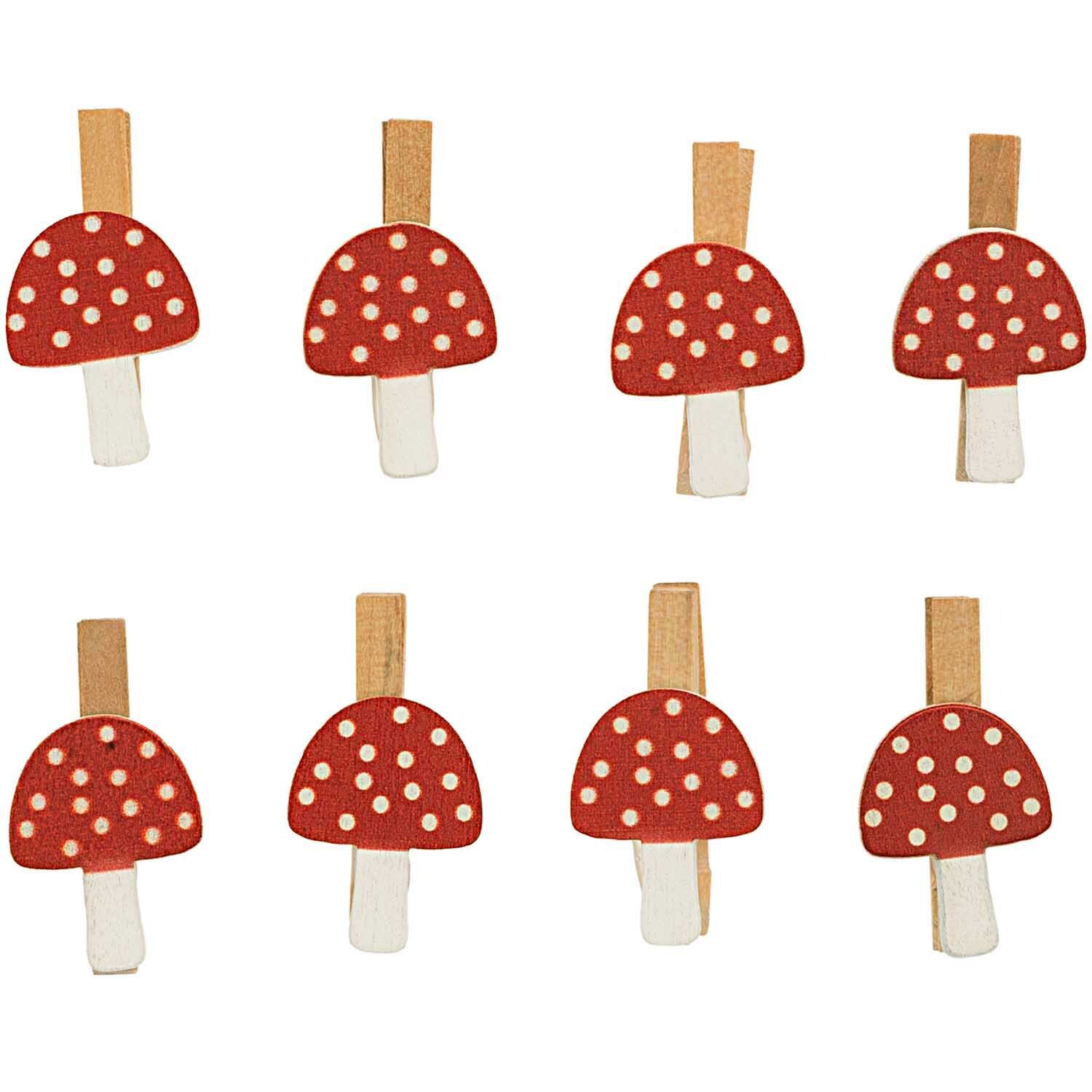 Holzclips Pilz rot-weiß von Rico Design, 8 Stück, zeigen rote Pilze mit weißen Punkten auf Holzklammern.