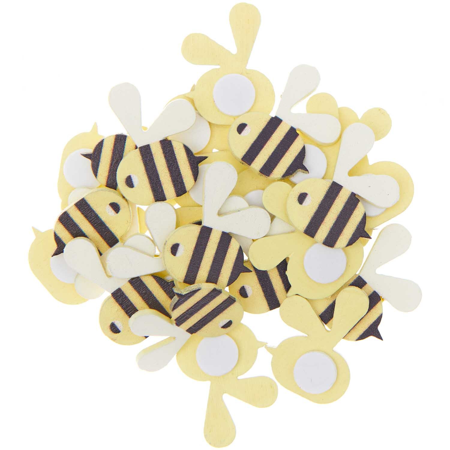 Holzsticker Bienen 24 Stück von Rico Design: Gelbe und schwarze Bienensticker aus Holz in einem Haufen. Ideal für kreative Bastelprojekte.