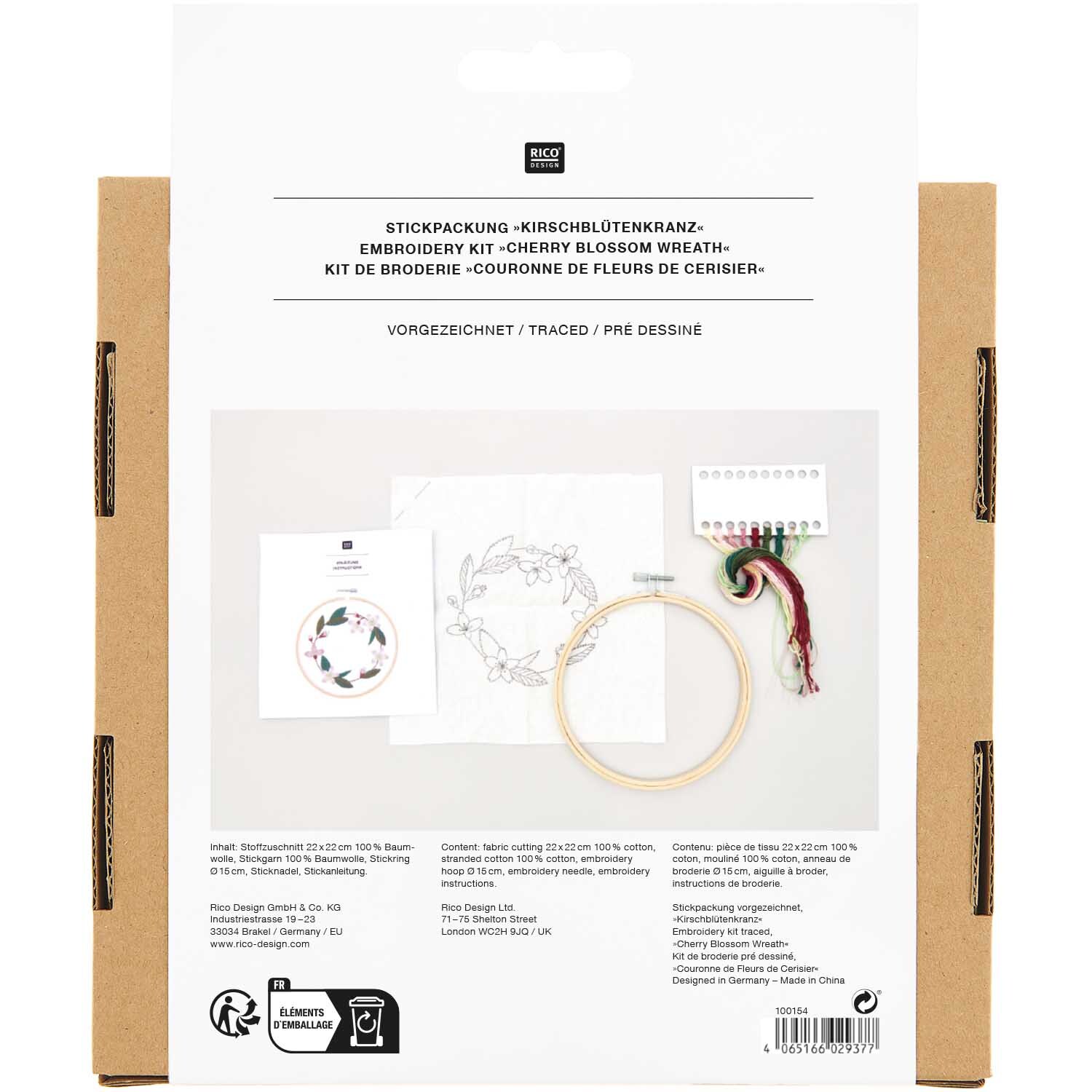 Kit de broderie couronne de fleurs de cerisier pré-dessiné from Rico Design Stickpackung Kirschblütenkranz vorgezeichnet von Rico Design, zeigt Stickrahmen und Garn auf weißem Hintergrund.
