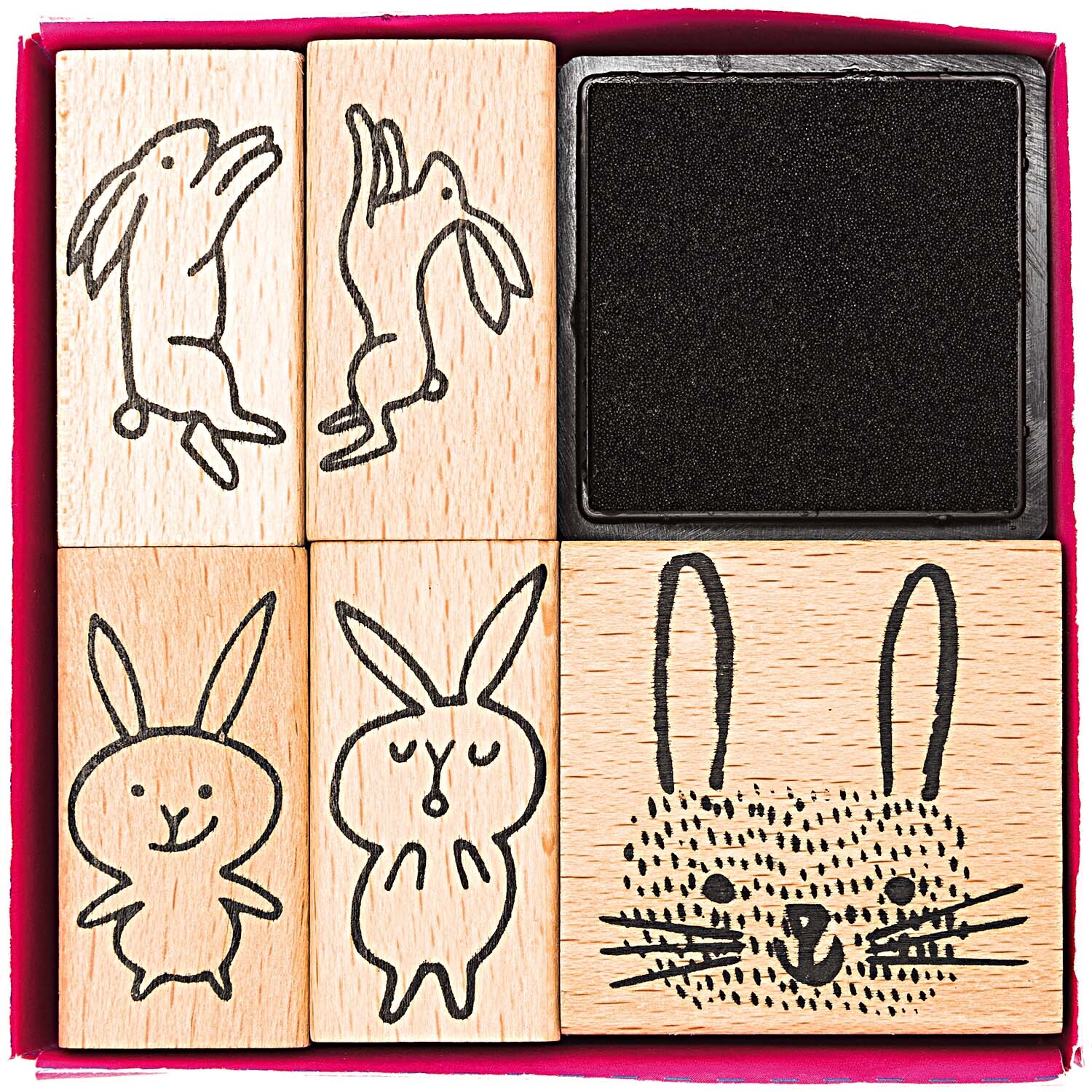Paper Poetry Stempelset Hasen: Sechs Holzstempel mit Hasenmotiven und schwarzem Stempelkissen von Rico Design.