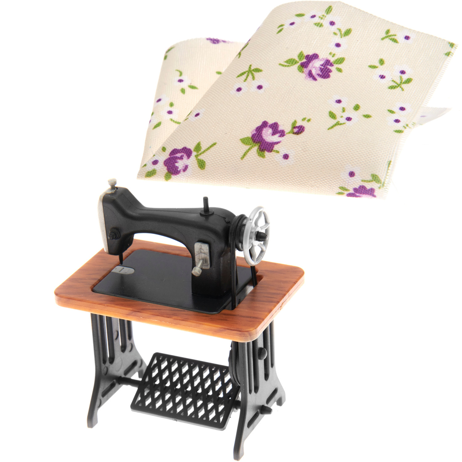 Miniatur Nähmaschine mit Stoff, dekoriert mit floralen Mustern, von Rico Design. Ideal für Sammler.
