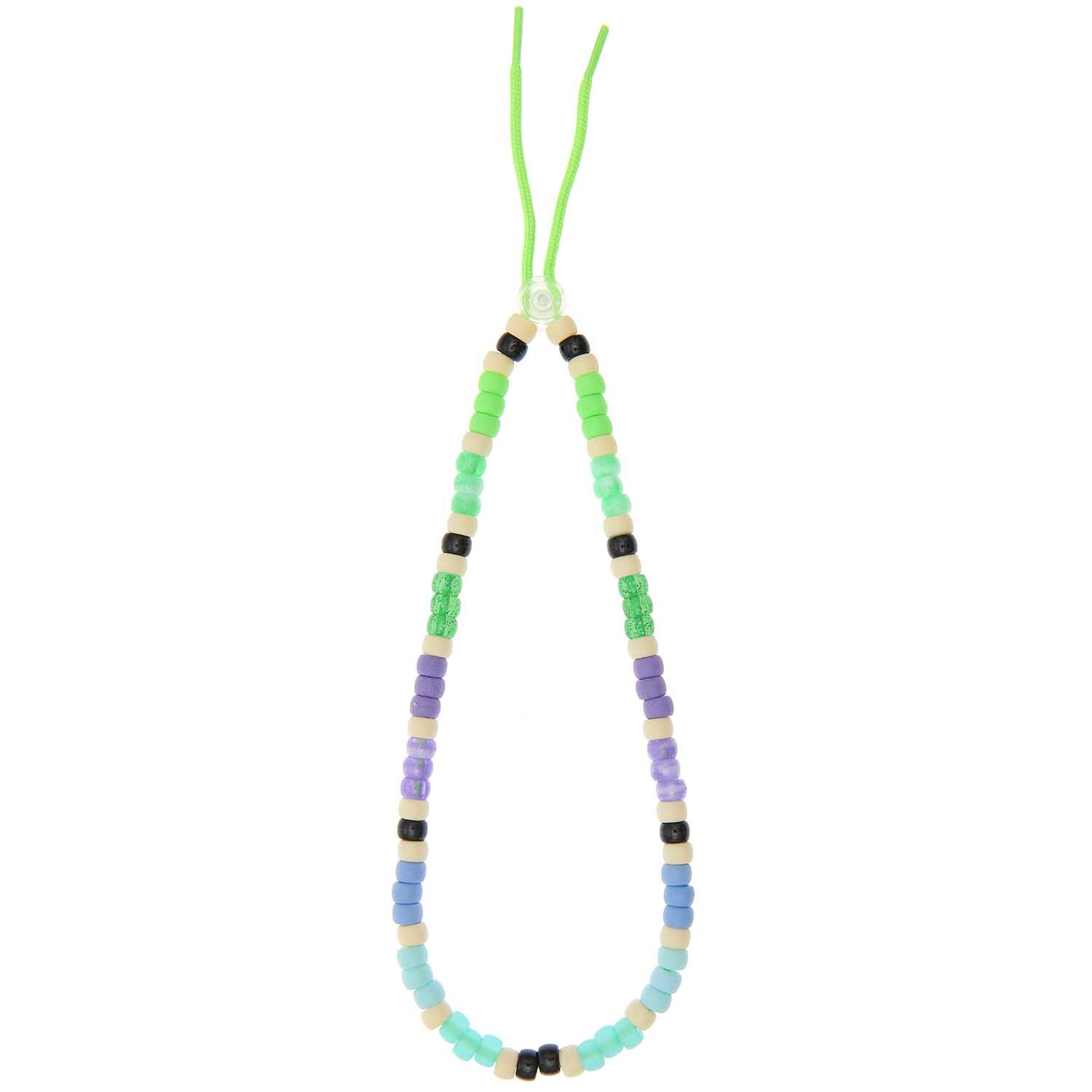 itoshii - Ponii Beads Aqua Mix 9x6mm 80 Stück von Rico Design Itoshii - Ponii Beads Aqua Mix 9x6mm, 80 Stück. Bunte Perlenkette mit grünen, blauen und lila Perlen auf grünem Band. Ideal für DIY-Projekte.
